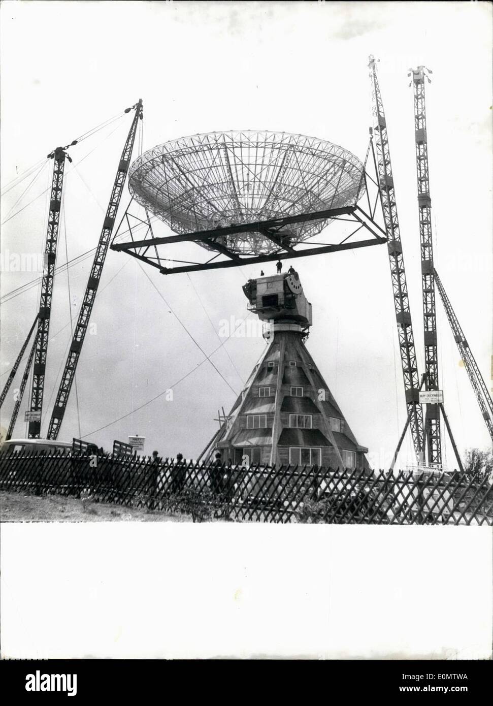 Sep. 09, 1956 - Twenty five meter concave mirror - German Radio telescope at Munstereifel: The huge 25 meter Concave Mirror of the first German Radio telescope was mounted recently in Munstereifel by engineers who carried out the heavy task in spite of stormy weather. Photo shows the scene as the huge mirror is hoisted in Munstereifel. Stock Photo