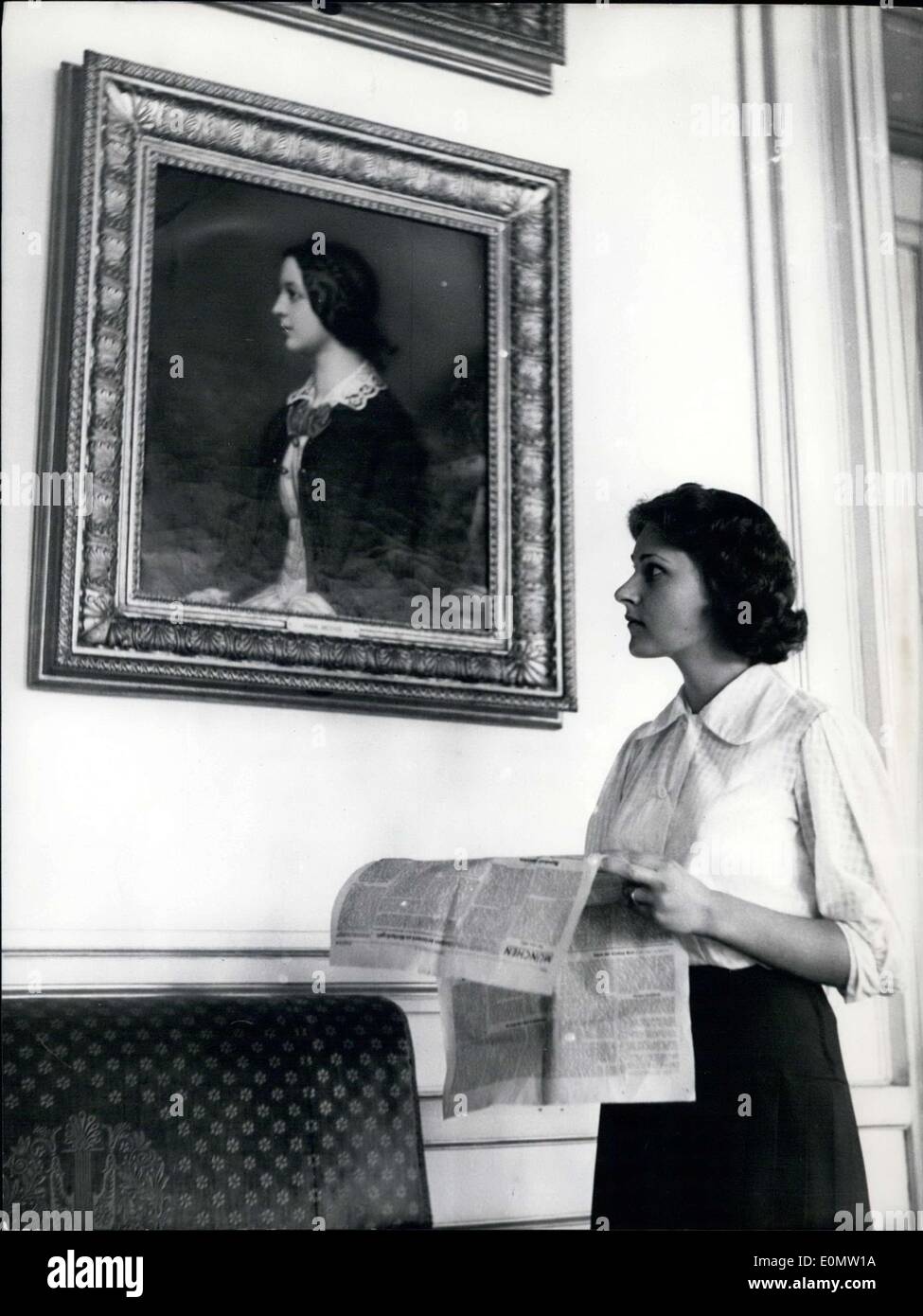 Jul. 06, 1956 - A competition was held to see which women looked the most like women painted in these portraits, which were found in a collection from King Ludwig I of Bavaria. Pictured here is 19 year old Irene Mosch. She is standing in front of the Josef Stieler painting of 15 year old Maria Dietsch. She hopes to win the competition with her likeness. Stock Photo