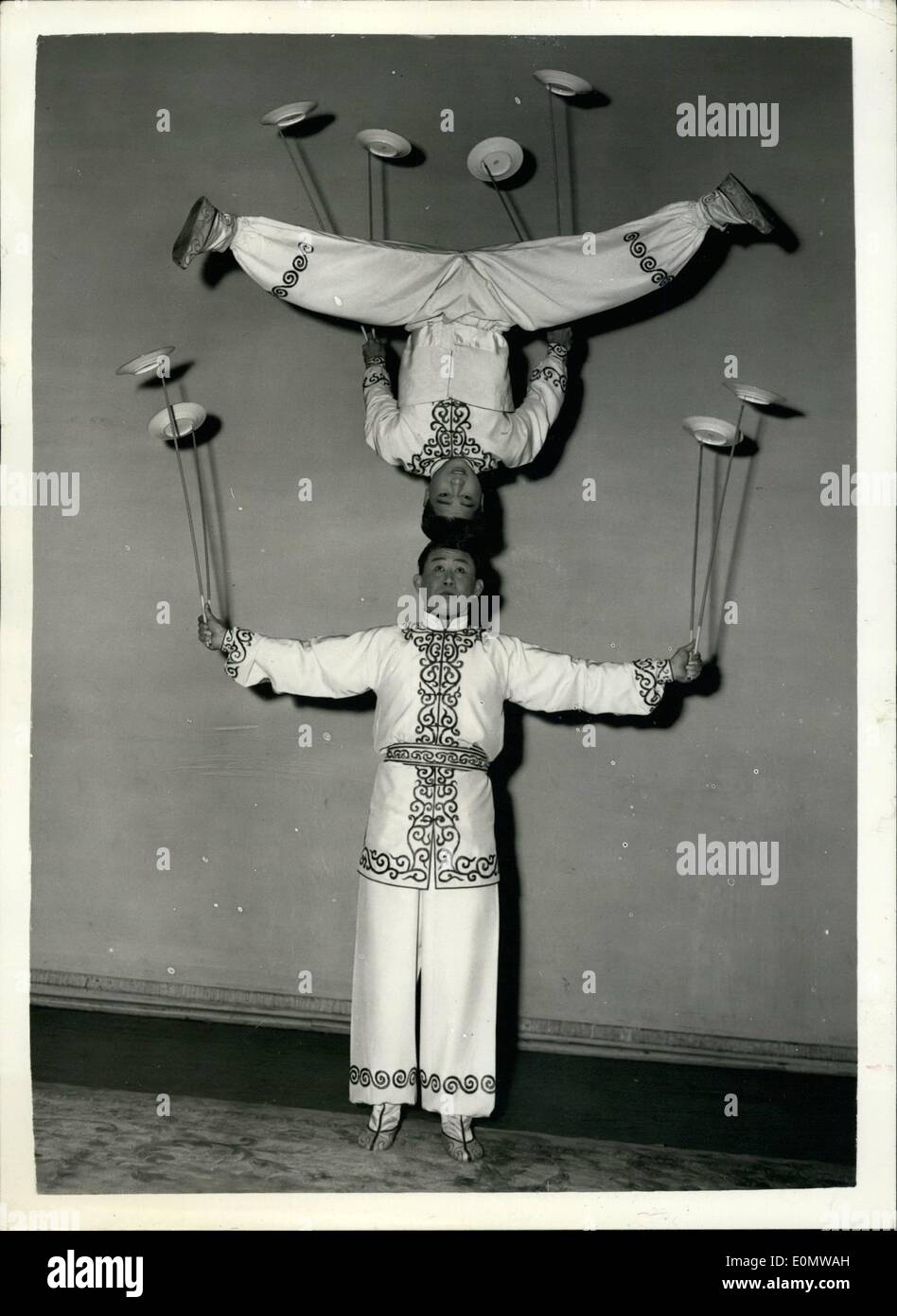Sep. 09, 1956 - Variety Theatre of China Rehearsals: Artists of the Variety Theatre of China, which tonight begins its three-week London season at the Princes Theatre, were to be seen rehearsing today. Photo shows: Rehearsing their balancing ''plate-spinning'' act - are TSAI CHUN (top) and Wang Wen Chieh, at the Princes Theatre today. Stock Photo