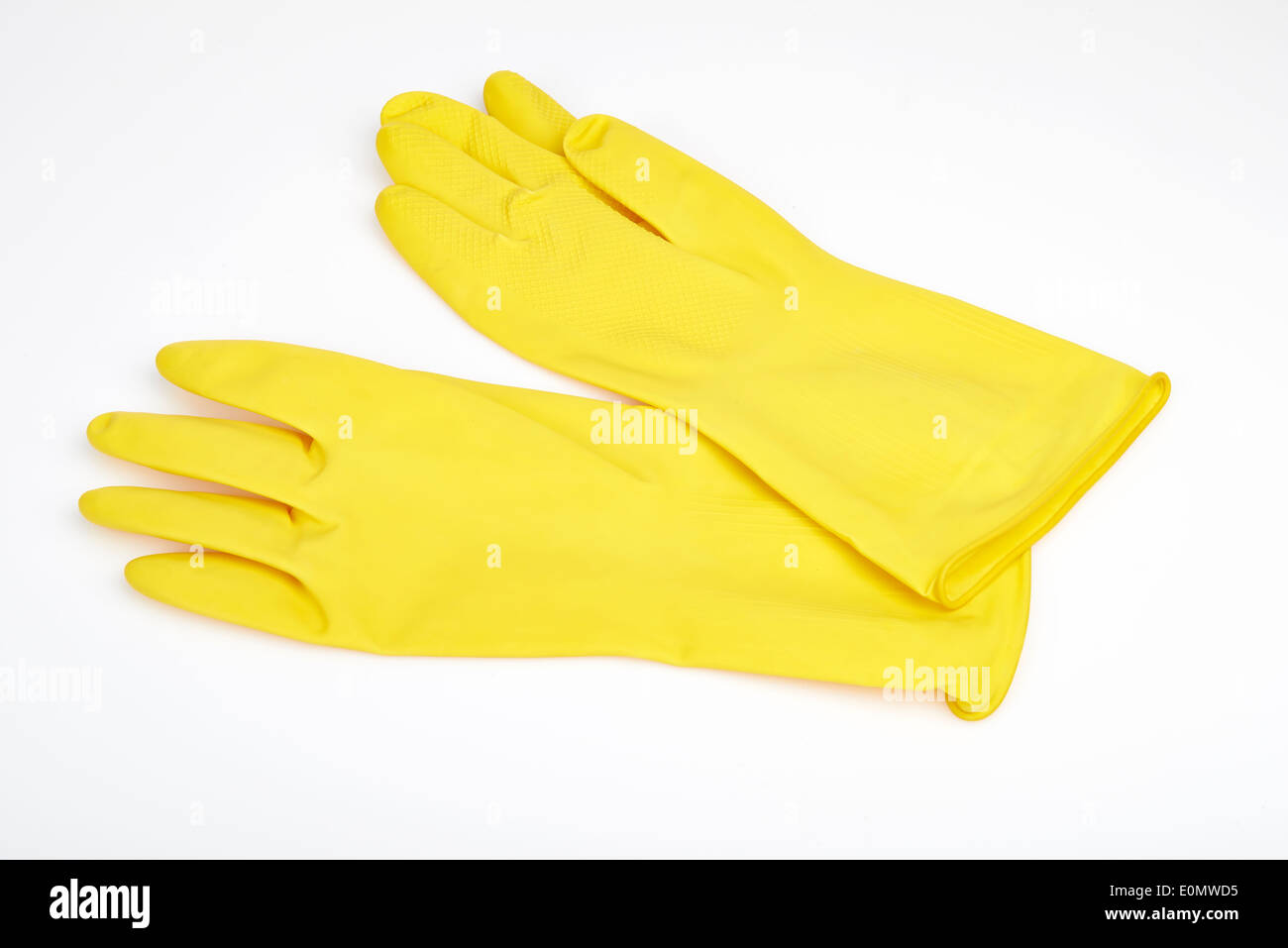 yellow rubber gloves on a white background Stock Photo - Alamy