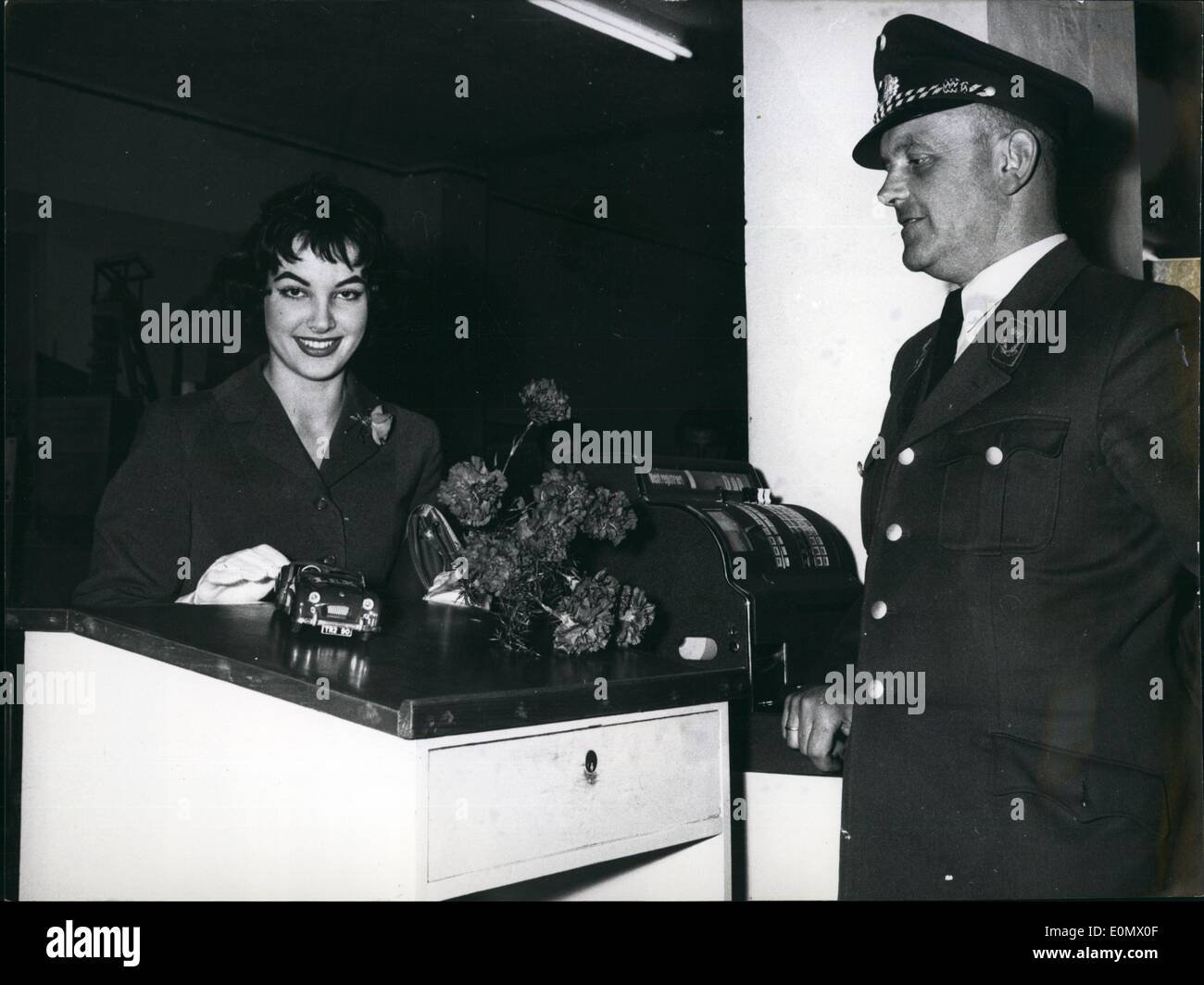 Oct. 10, 1956 - ''Miss World'': Miss Petera Schurmann was arriving today on Dusseldorf airport from London. Photo Shows Miss World shows the customer a model from her new English sporting car. Stock Photo