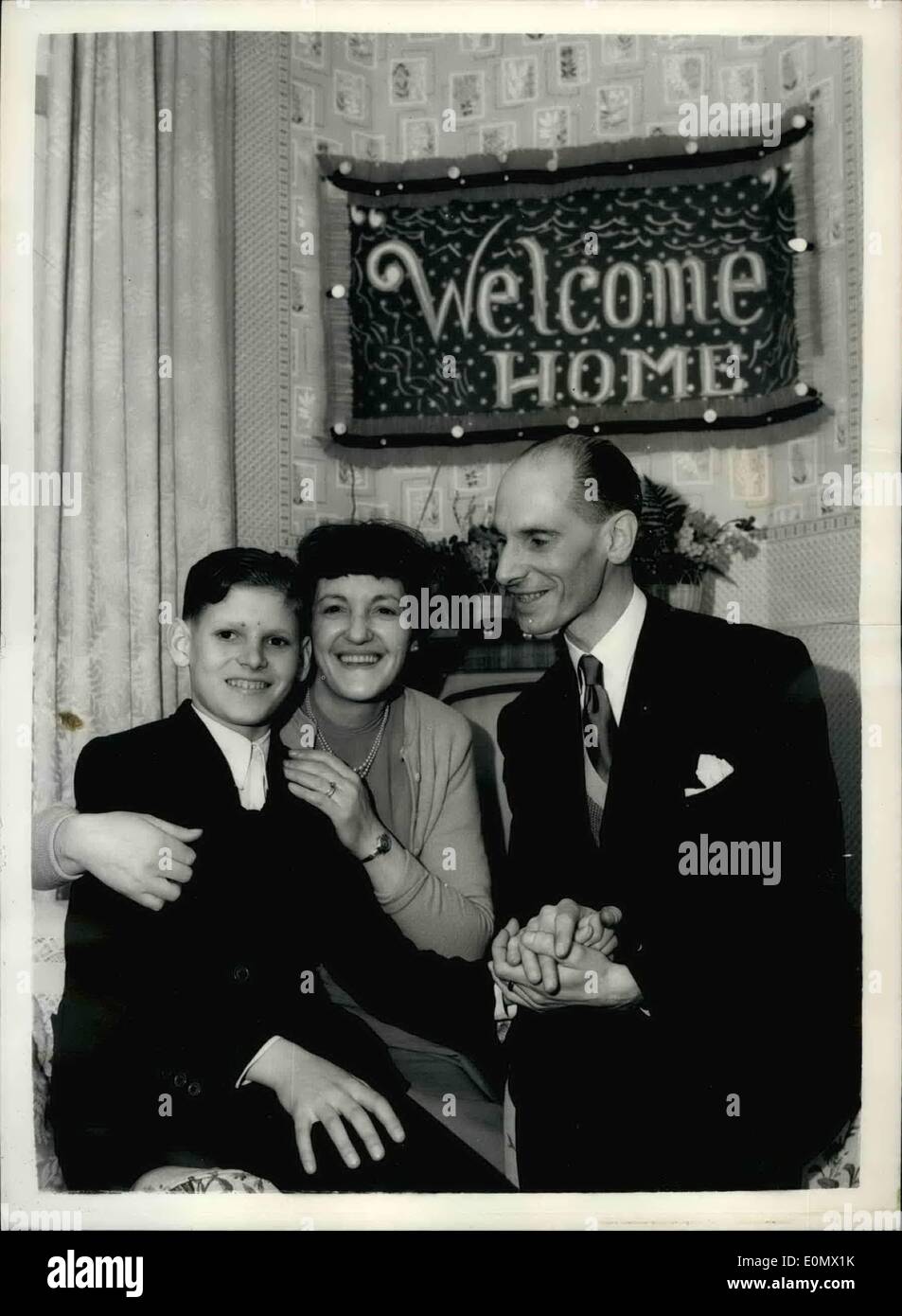 Oct. 10, 1956 - Fourteen year old boy arrived in London, meets father first time since 1942; Fourteen year old Richard Mostowy arrived in London this morning and was welcomed by his father 45 year old John Mostowy - new a British subject. John left home in Gdynia, Poland, in 1942 to be conscripted in the German Army. Drafted to France he contacted the French Underground movement and escaped to England. Joined the Polish Army in Scotland and was demobilized in 1947. He then heard that his Polish wife had deserted his son - leaving him in the cars of his sister Stock Photo