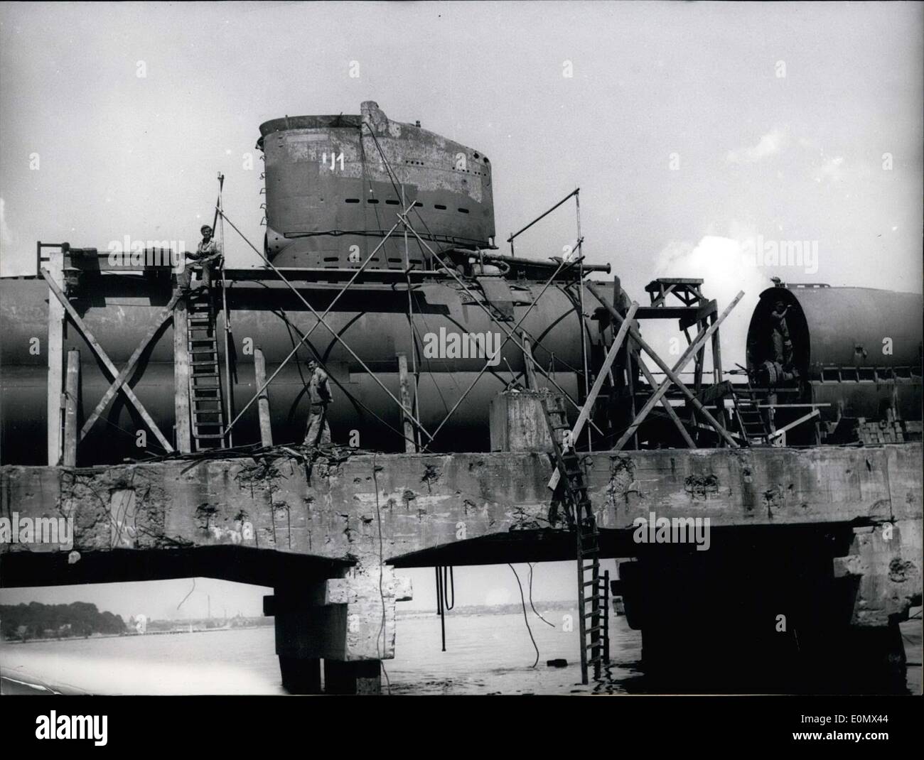 Jul. 22, 1956 - The two first German U-Boats of the new German navy are currently being restored at Howaldtswerken. The U-Boats, sank in the last days of the war, were salvaged from the East Sea by a Hamburg firm. After extensive examinations by experts the Federal Defense Ministry decided to take over the two boats, paying 800,000DM to do so. After repairs they will be used as instructional boats. Pictured: The first salvaged boat ''U 2365,'' cut apart in order to repair it. Stock Photo