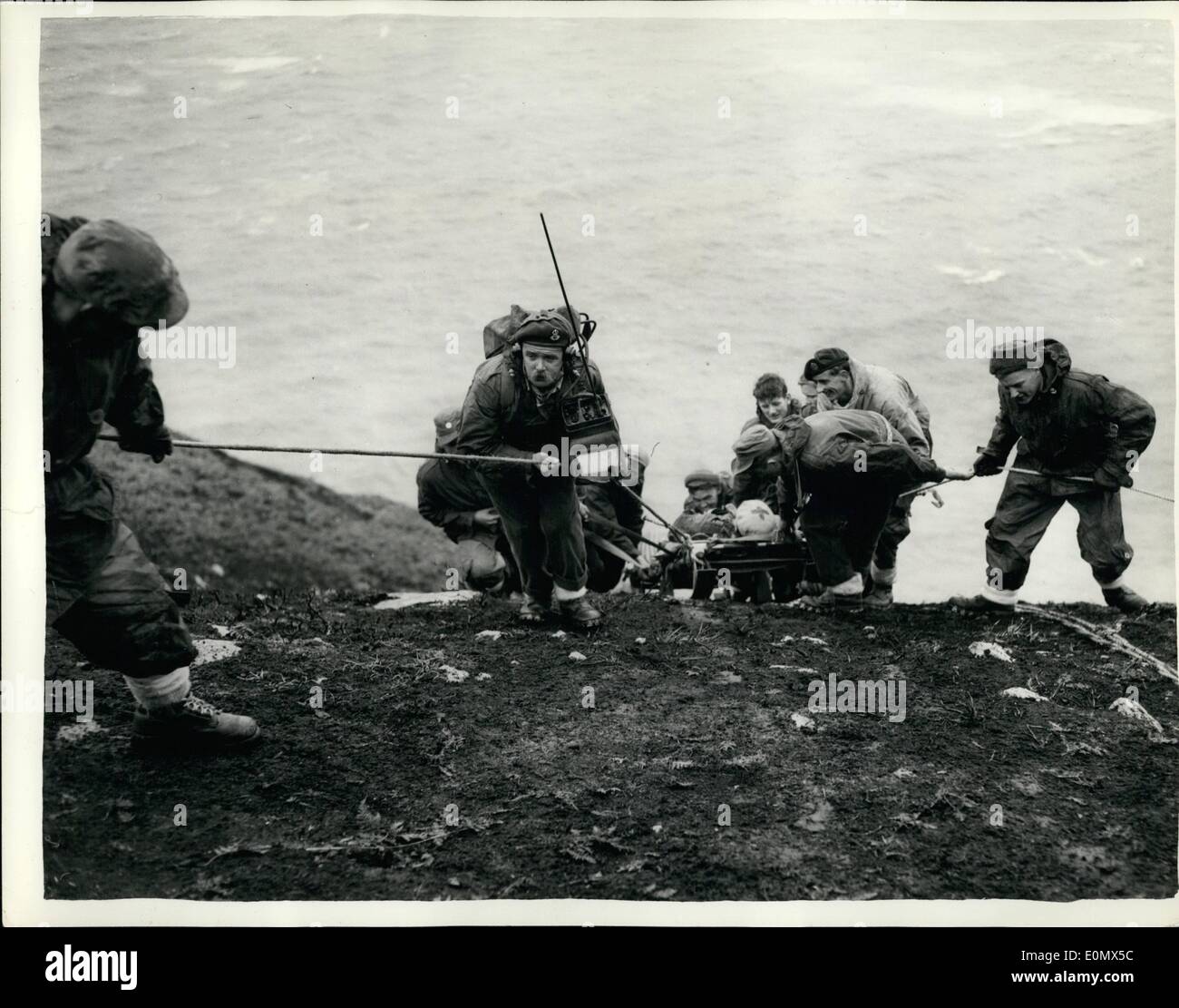 Aug. 02, 1956 - 2-8-56 Royal Air Force Mountain Rescue Team in training. Combined exercise in Angelsey. Men of the Royal Air Force Mountain Rescue Team were to be seen in training on the Holyhead Mountain, Anglesey, part of the combined search and rescue operations of the RAF. All members of the teams age volunteers drawn from all branches and trades of the service, and are all enthusiastic climbers. Other parts of the exercises which was to have included the use of vessels and helicopters was cancelled owing to the gale force winds. Keystone Photo Shows: Flying Officer G.N Stock Photo