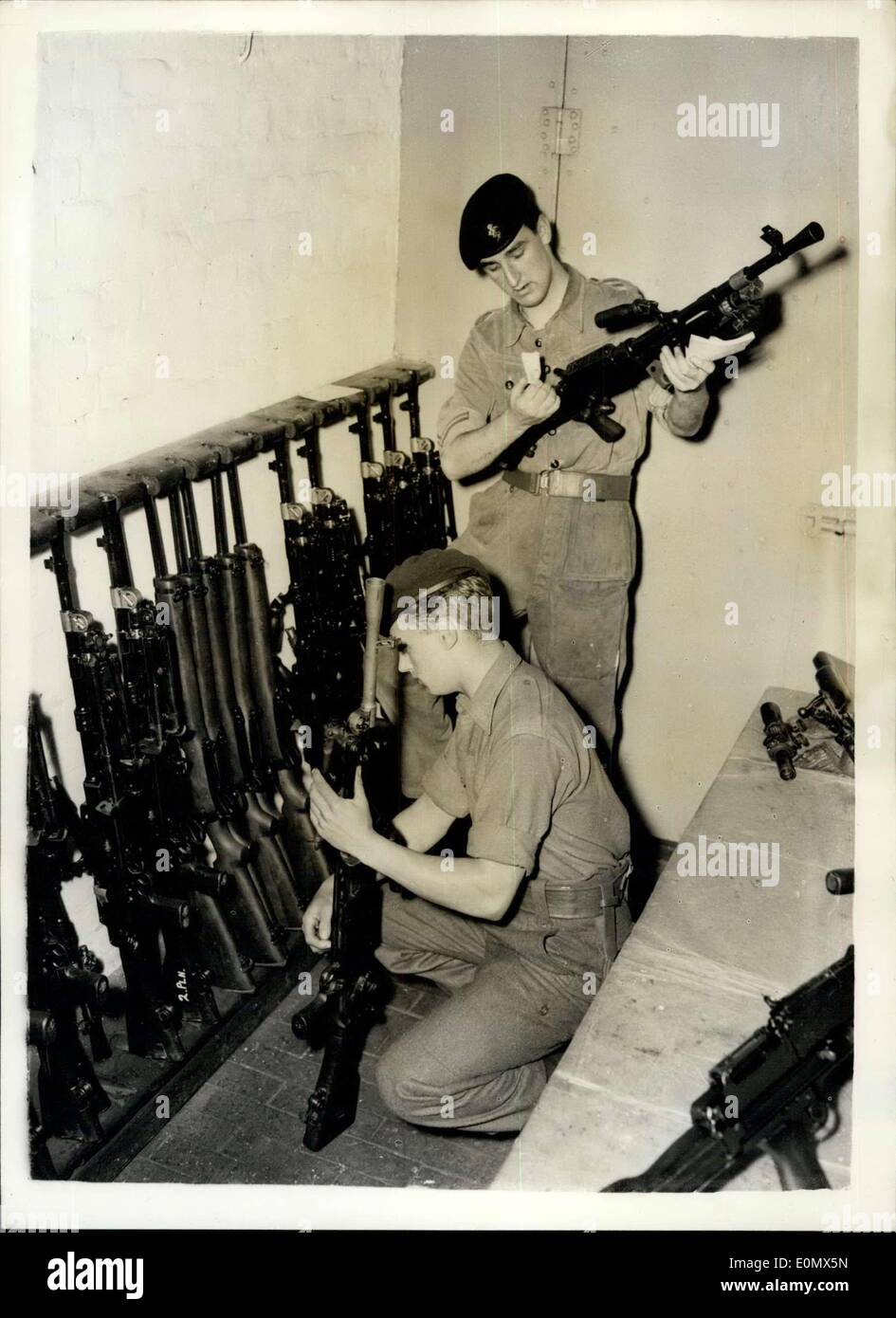 Aug. 03, 1956 - Operation Suez commence's checking arms - at Warley Barracks.: Men of the Oxford and Bucks Light Infantry were to be seen preparing for duty at the Warley Barracks, Essez - today - owing to the Suez Canal Emergency. Some have been recalled from leave. Photo shows checking arms in the armoury - at the Barracks today. PTE. John Bailey (19) from Wellington Shrepshire (nearest camera) and L/CPL.John Graham of R.E.M.E. from Liverpool. He is 19. Stock Photo