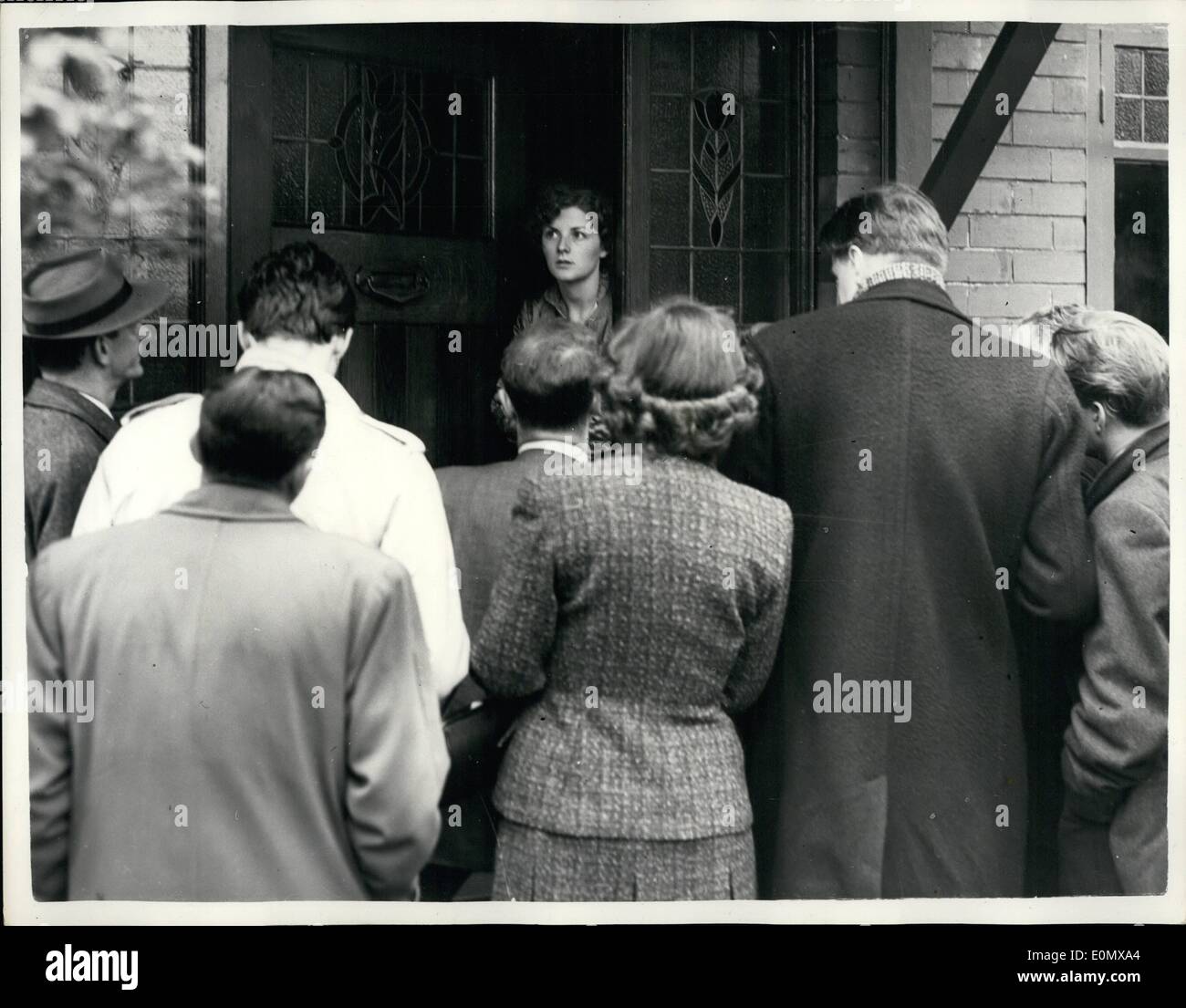 Oct. 10, 1956 - Daughter of Mrs Ryall. Photo shows Miss Wendy Ryall, 23 year old daughter of Mrs. Kathleen Ryall, the 52 year old widow friend of the ''drowned'' vicar, the Rev. Philip St. John Ross - seen at the door of a friends house  Bramhall yesterday, when she was interviewed by reporters. Stock Photo