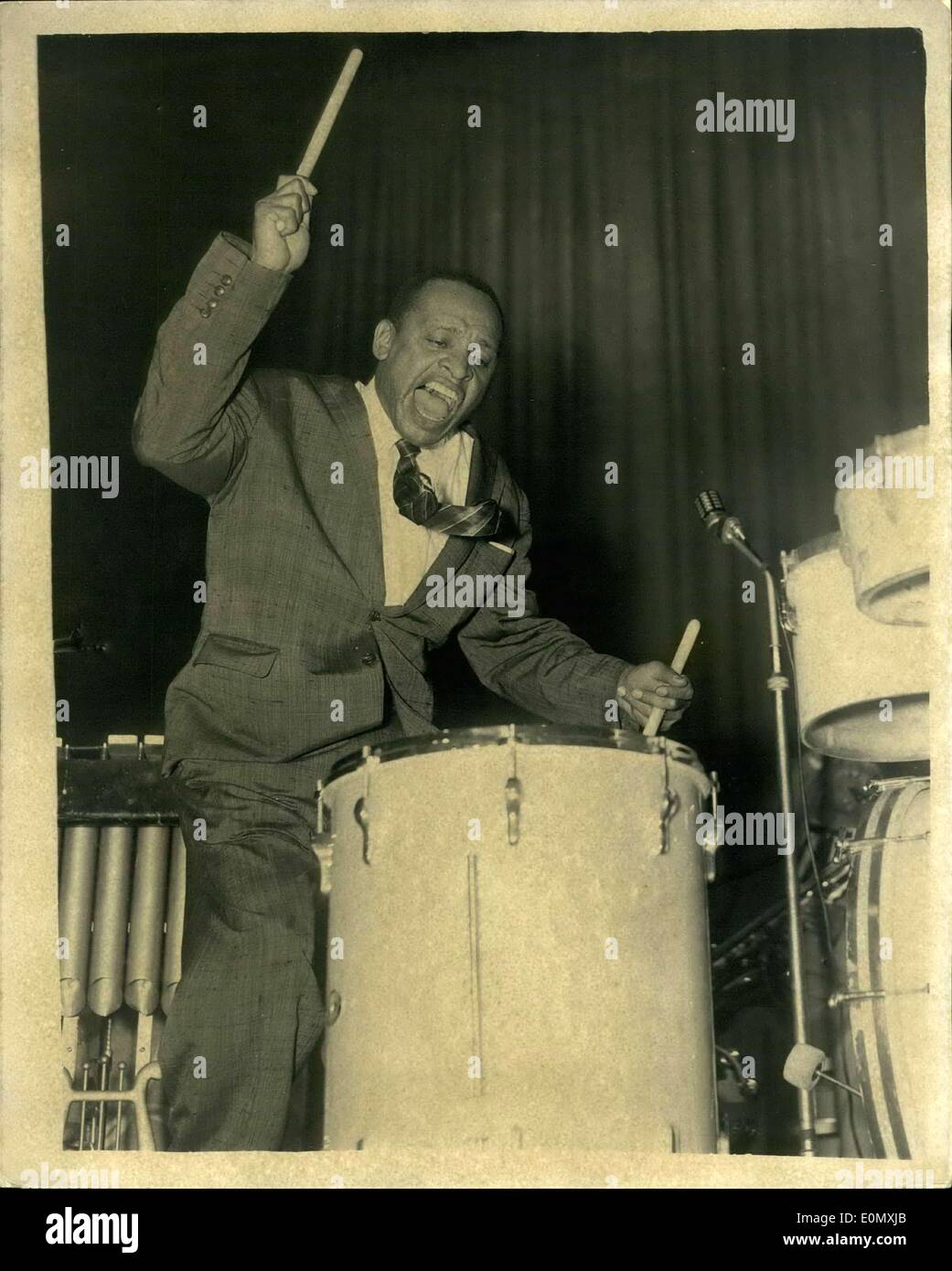 Oct. 21, 1956 - America's Rock N' Roll King Gives His First Performance At The Empress Hall. America's Rock N' Roll king, Lionel Hampton who arrived in Britain with his band to start a week's tour, opened with his first performance at the Empress Hall, Earls Court. Photo Shows: Lionel Hampton in action as he plays the drums during his performance. Stock Photo