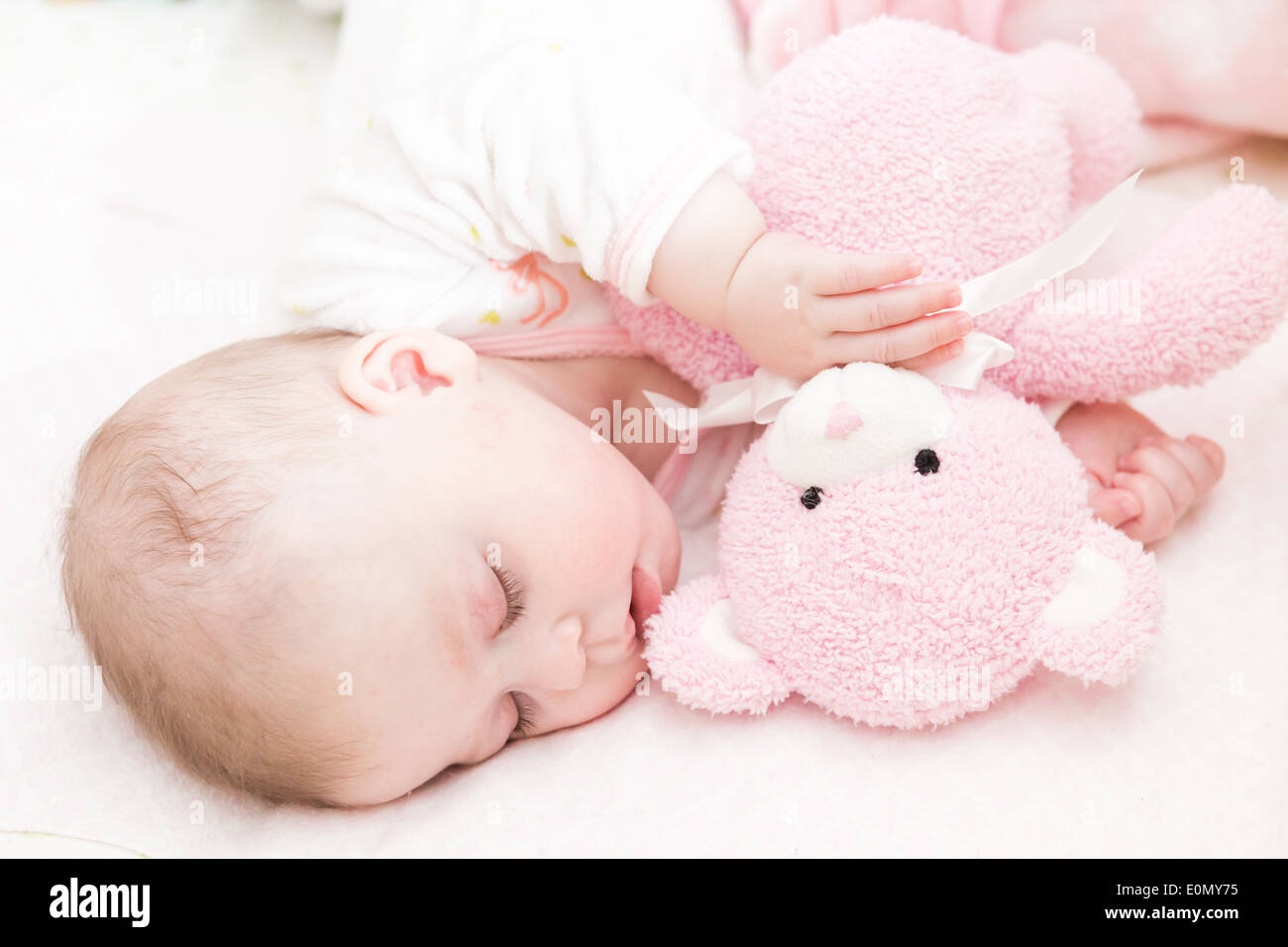 Cute baby girl sleeping in her crib Stock Photo Alamy