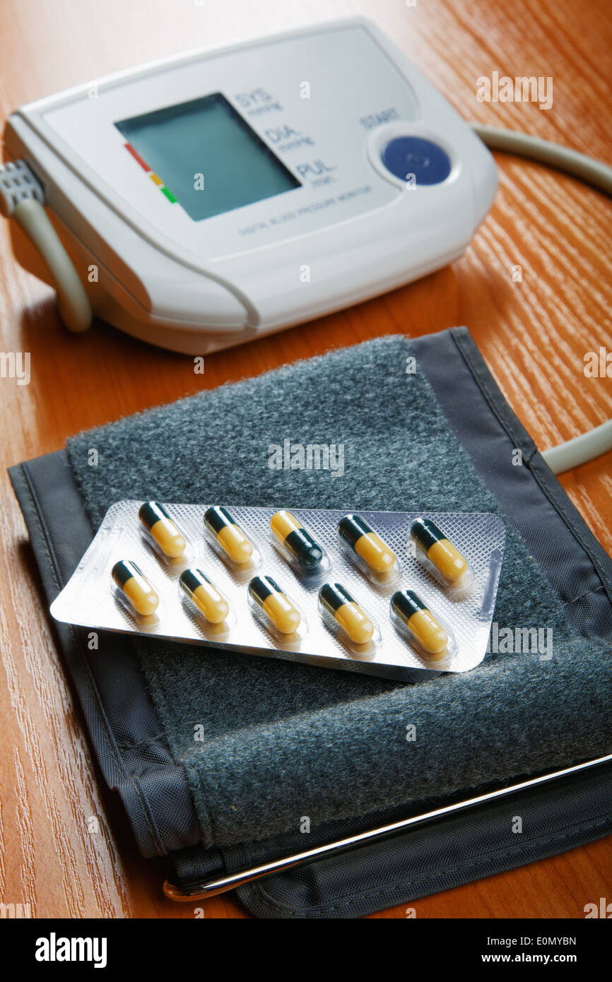 Tablets and the device for pressure measurement on a table Stock Photo