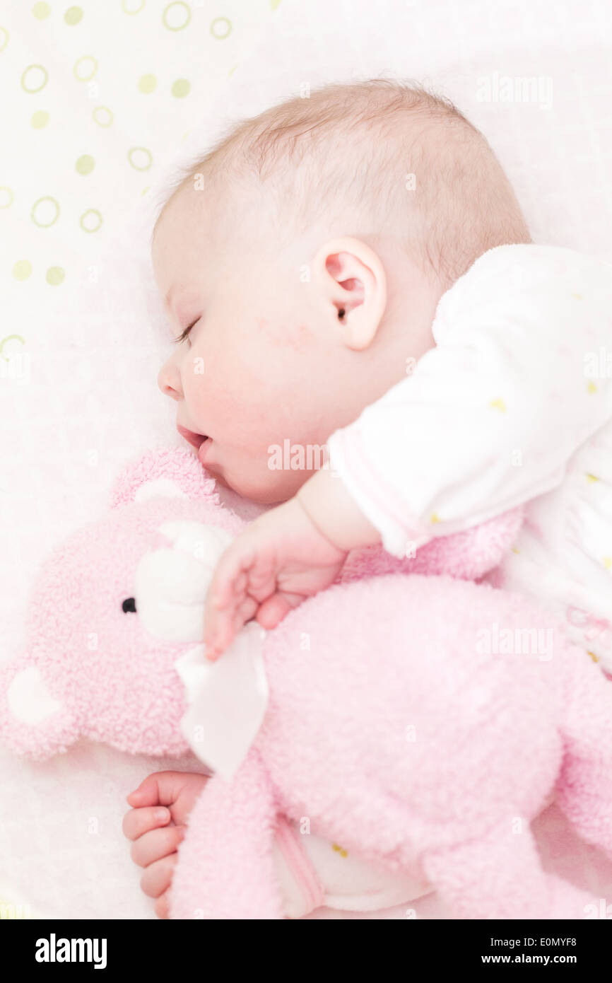 Cute baby girl sleeping in her crib Stock Photo Alamy