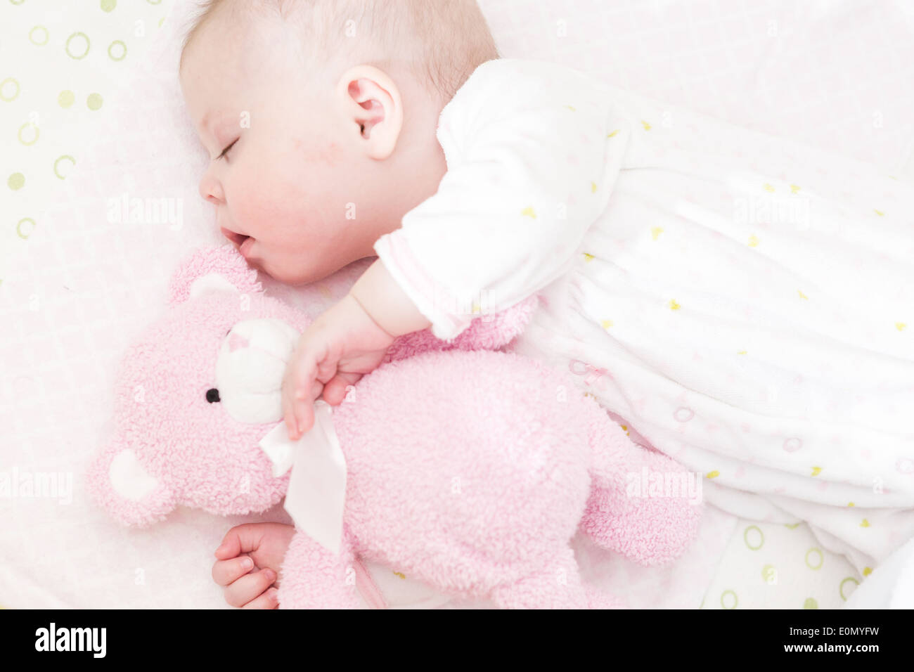 Cute baby girl sleeping in her crib Stock Photo Alamy