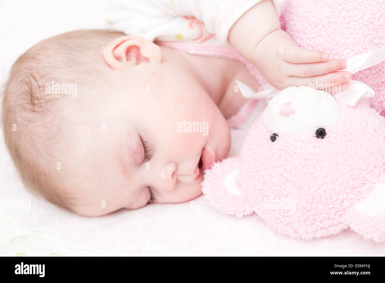 Cute baby girl sleeping in her crib Stock Photo Alamy