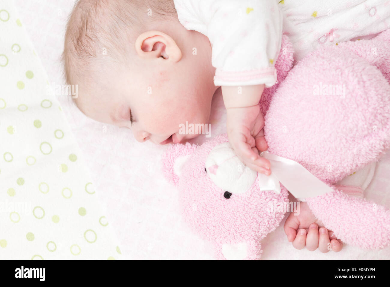 Cute baby girl sleeping in her crib Stock Photo Alamy
