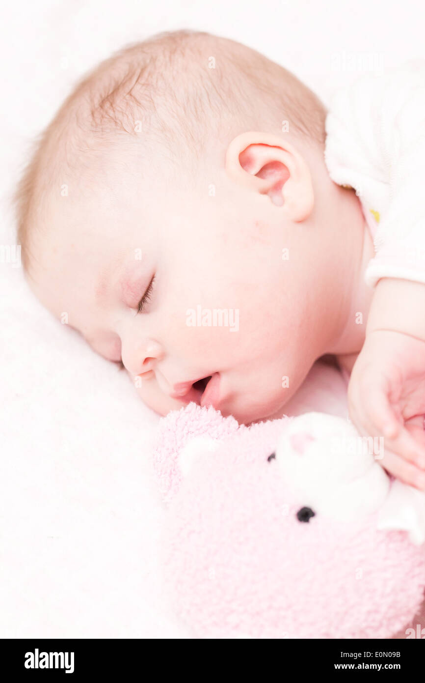 Cute baby girl sleeping in her crib Stock Photo Alamy
