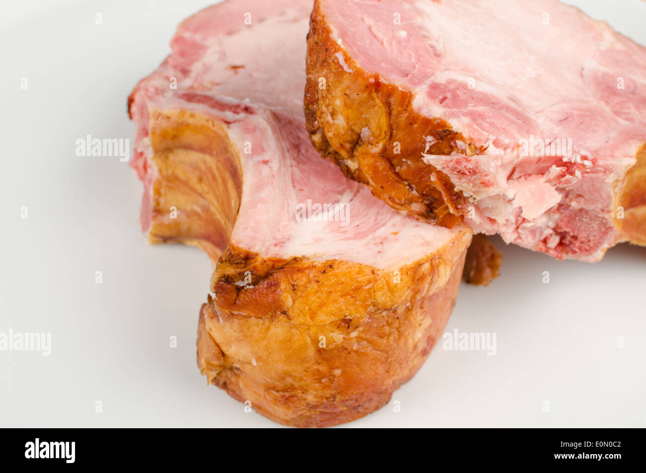 Two thickly cut kasseler pork chops ready to be cooked Stock Photo