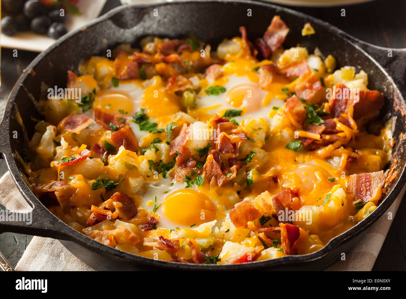 https://c8.alamy.com/comp/E0N0XY/homemade-hearty-breakfast-skillet-with-eggs-potatoes-and-bacon-E0N0XY.jpg