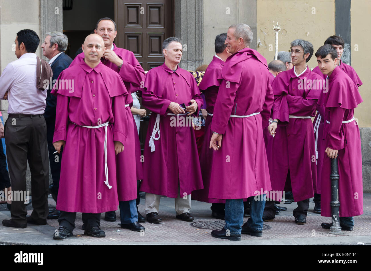 Madrid, Spain. 15th May, 2014. Fiesta de San Isidro, Madrid Credit:  Jennifer Booher/Alamy Live News. Acolytes gathering before the procession, Fiesta de San Isidro, Madrid. These men carry the statues of San Isidro and Santa Maria. Stock Photo