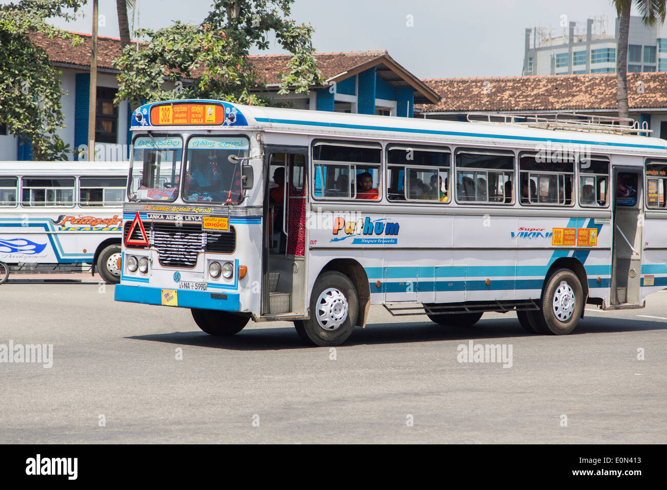 Unidentified passengers at Lanka Ashok Leyland bus on the street of Galle, Sri Lanka. Lanka Ashok Leyland is Joint venture with Ashok Leyland, second largest commercial vehicle manufacturer in India Stock Photo
