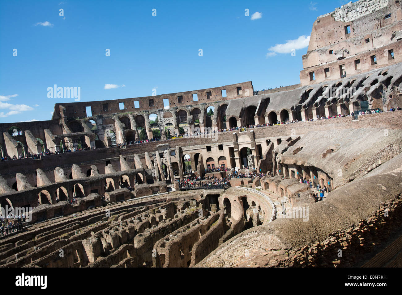 Rome,italy-April 17,2014:people admire the interior of the ancient roman coliseum in the sunny day in the center of Rome Stock Photo