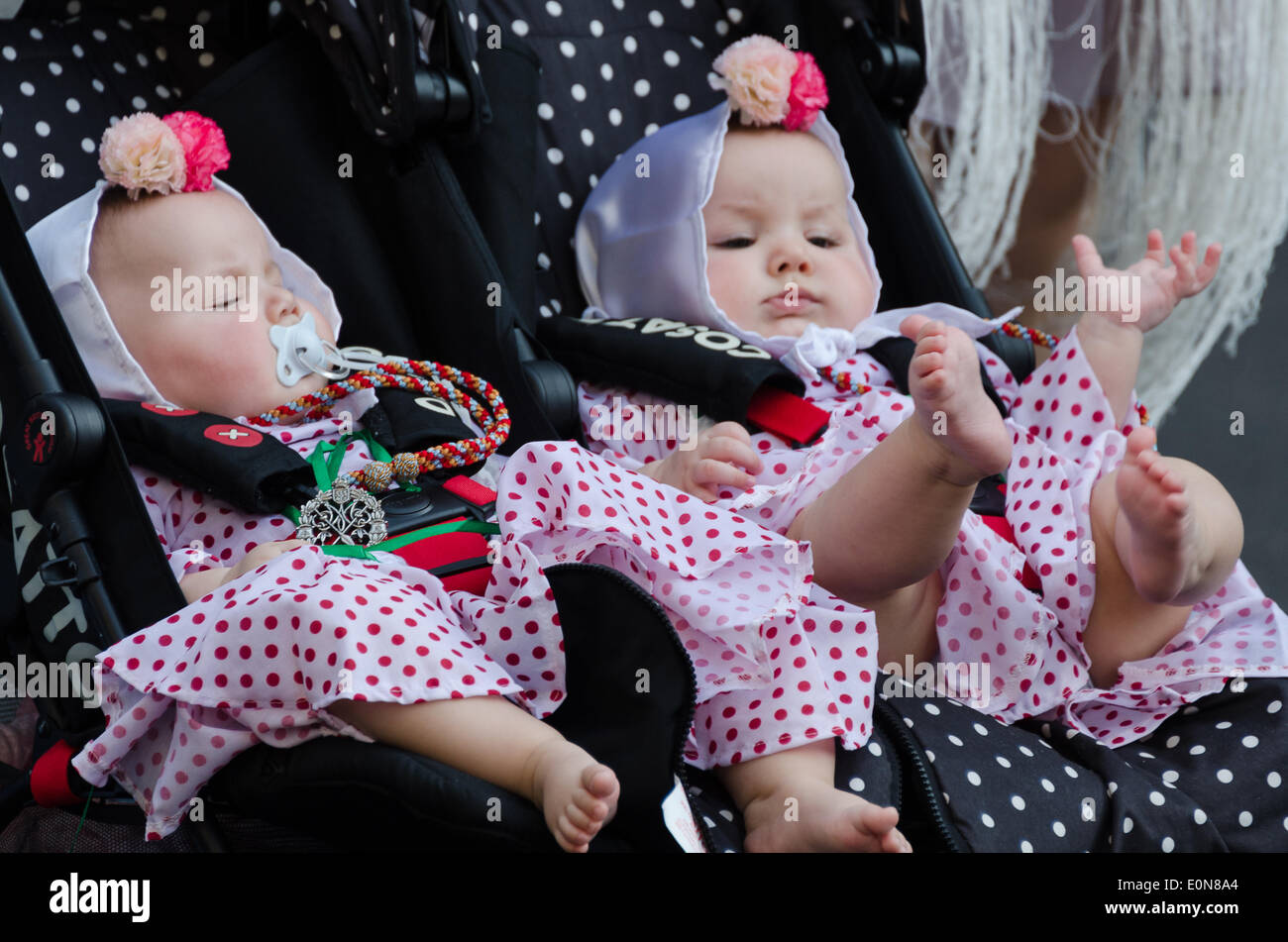 Two infants dressed in traditional chulapa costumes at the Fiesta de San  Isidro, Madrid Stock Photo - Alamy