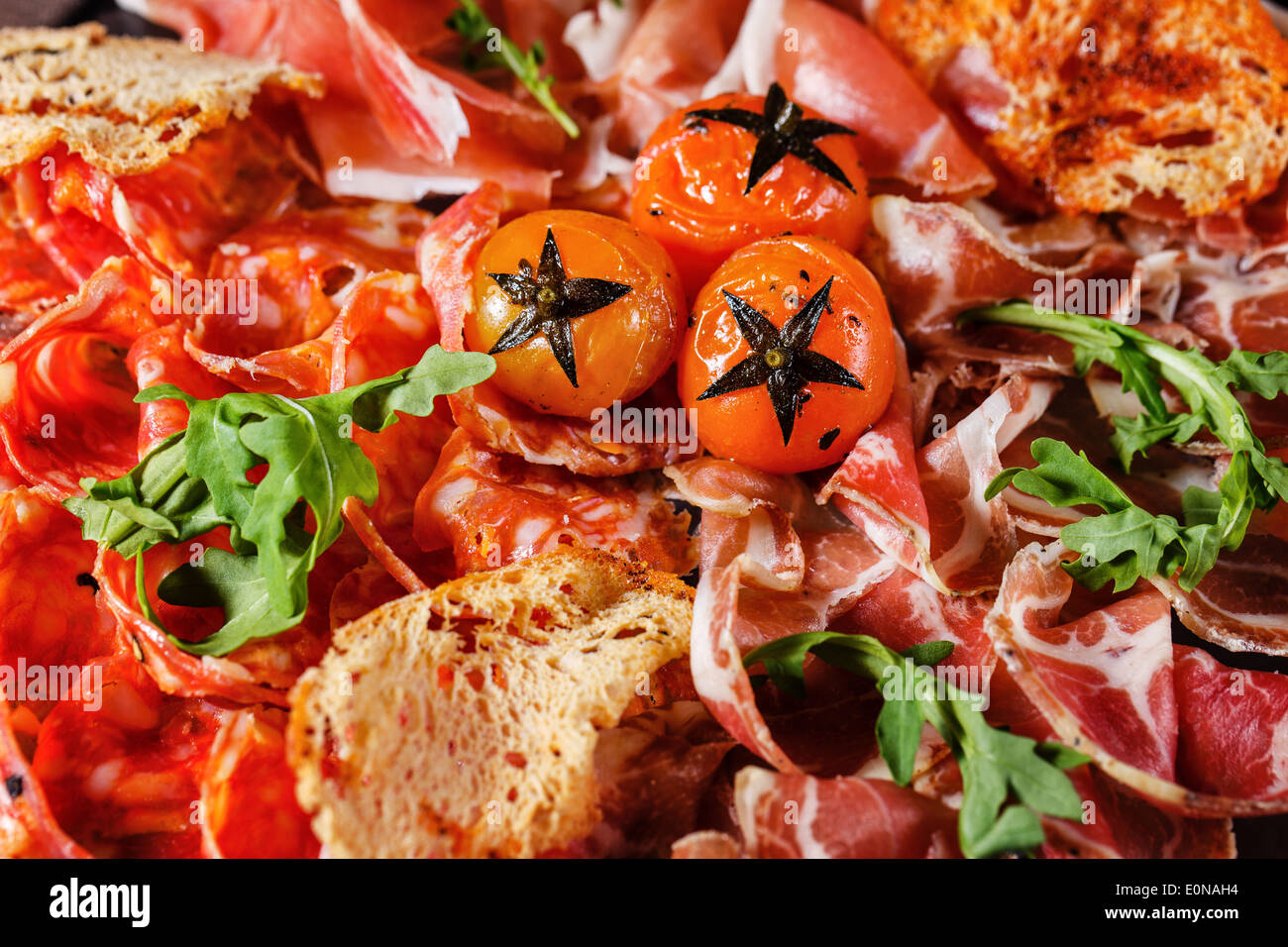 Bacon and sun-dried tomatoes shot closeup, restaurant food Stock Photo