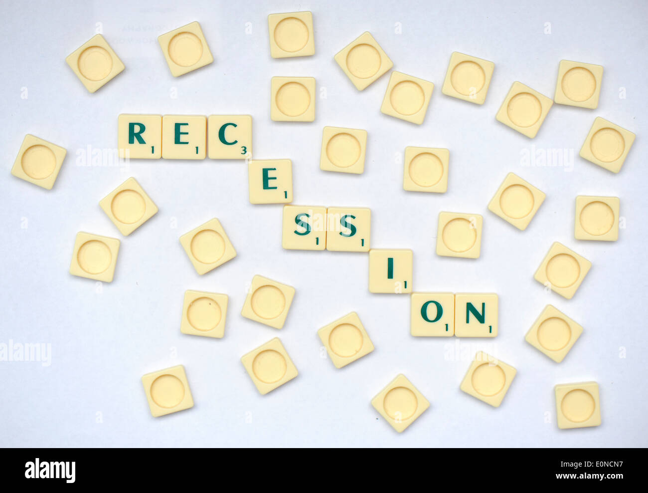 Scrabble tiles reading out the word recession. Stock Photo