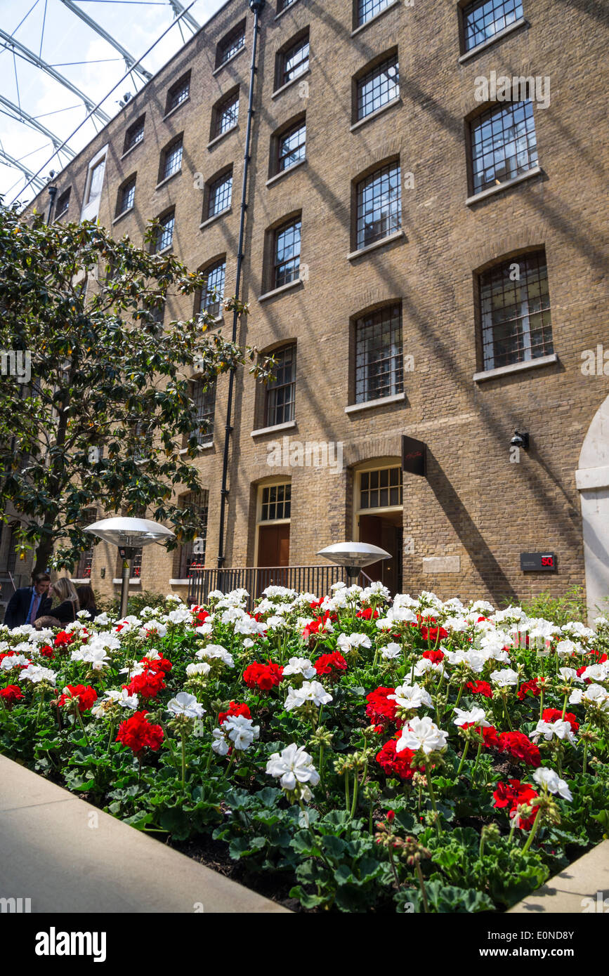 Flowerbed of white and red carnation flowers, Devonshire Square SQ, City of London, UK Stock Photo