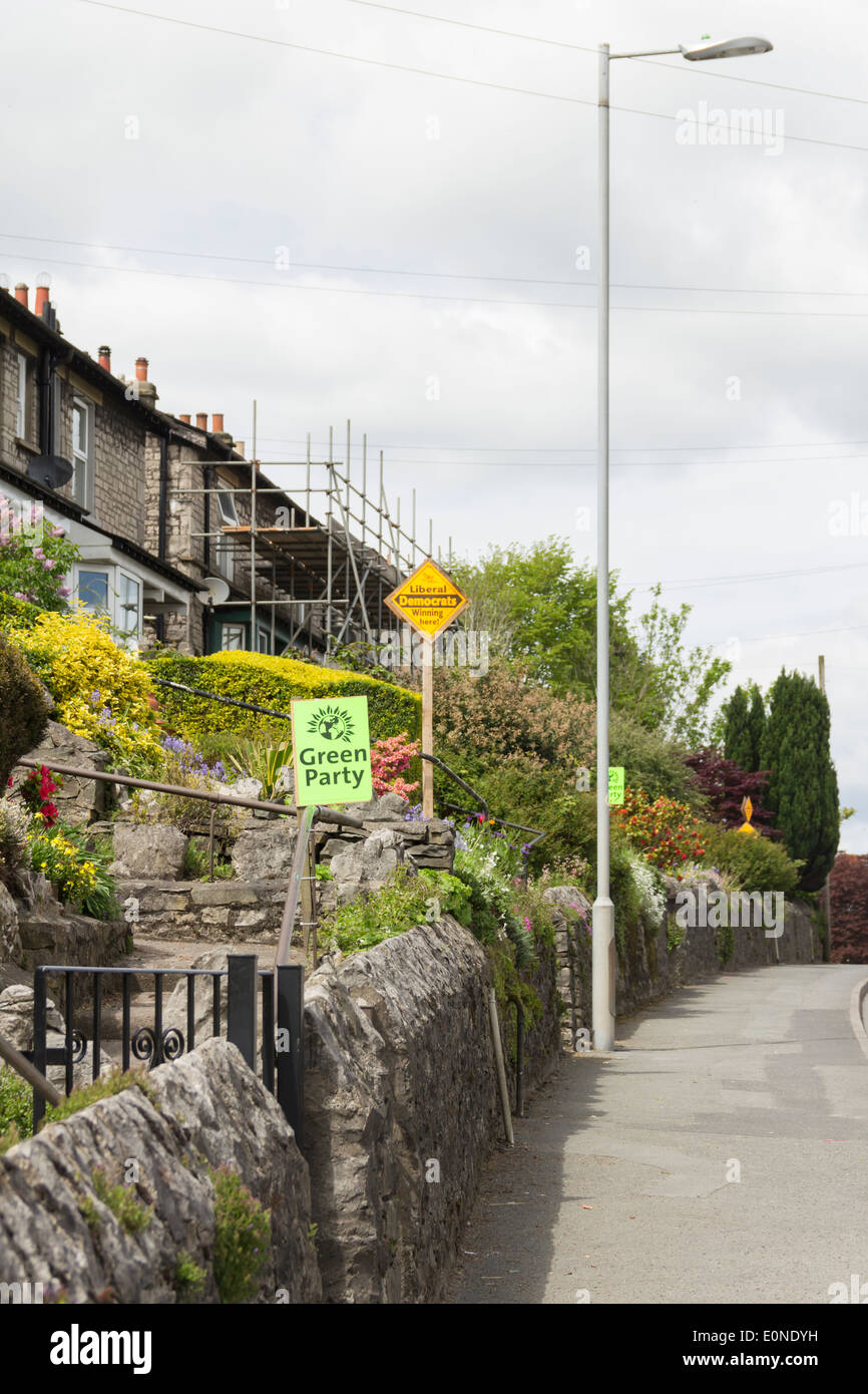 Green Party & Liberal Democrat campaign banners compete for attention in Kendal, prior to the 2014 European Parliament elections Stock Photo