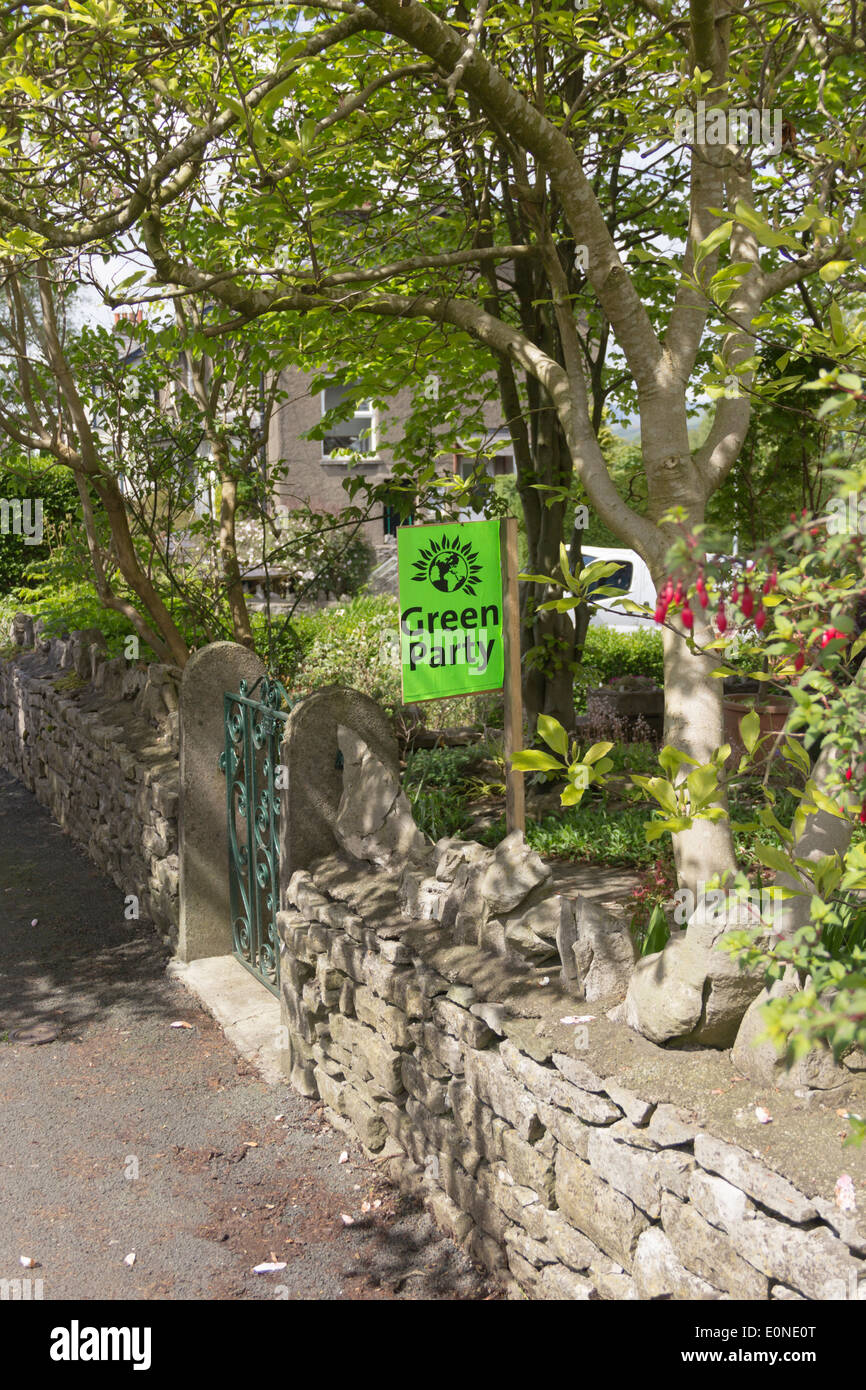 Green Party campaign banner outside a house in Kendal, Cumbria in the run up to the 2014 European Parliament elections Stock Photo