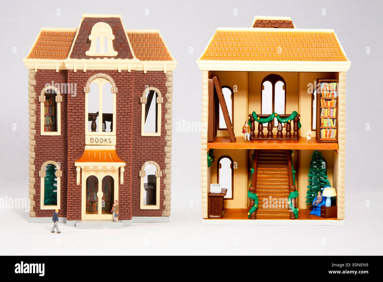 Interior and exterior views of a book store replica with miniature people Stock Photo