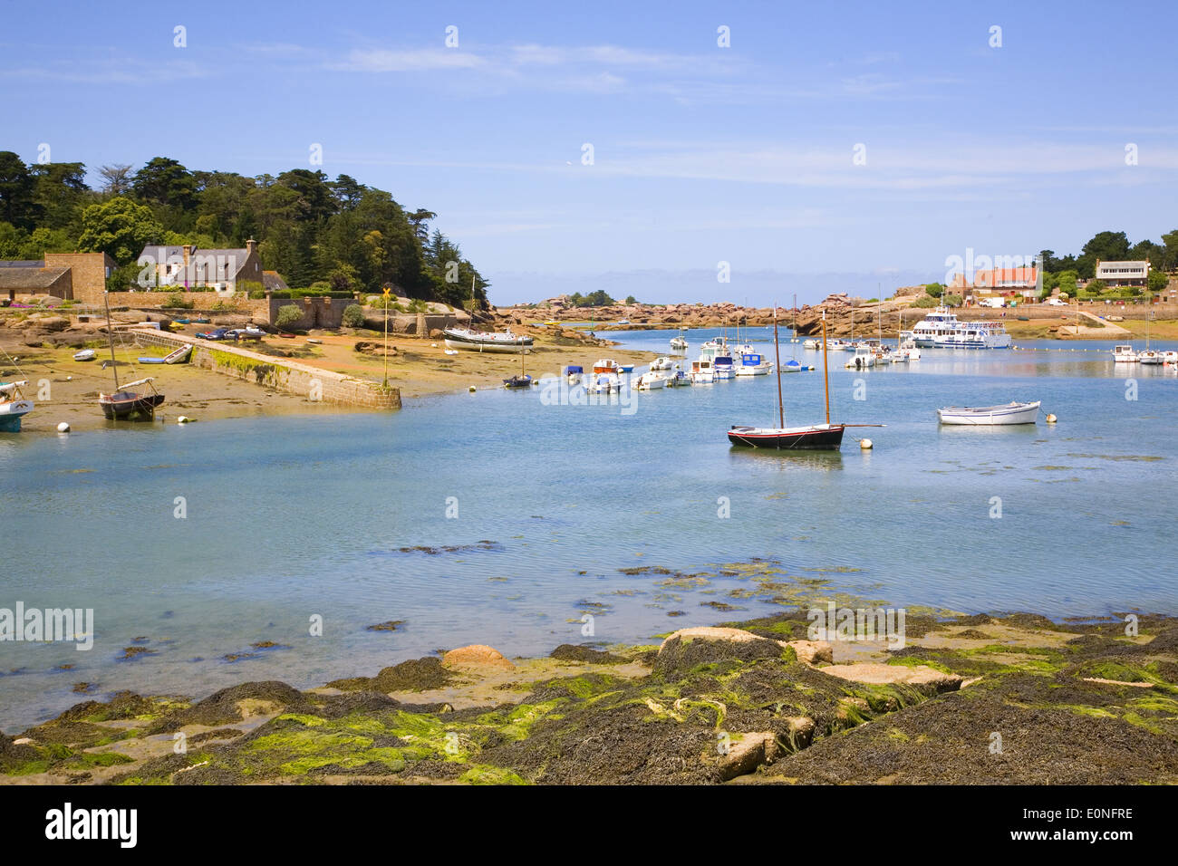 Harbor in Ploumanach and pink granite coast of Brittany, France Stock Photo