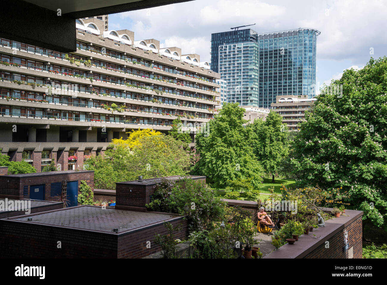 Barbican residential estate, Woman sunbathing, City of London, UK Stock Photo