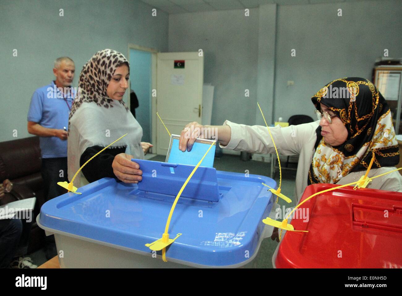 (140517)-- TRIPOLI, May 17, 2014(Xinhua)-- Citizens cast their ballots in Tripoli Center on May 17, in Tripoli, Libya. Voters in Libya's capital Tripoli cast their ballots Saturday to elect four new municipal councils, as part of a gradual electoral process that began several months ago. (Xinhua/Hamza Turkia) Stock Photo