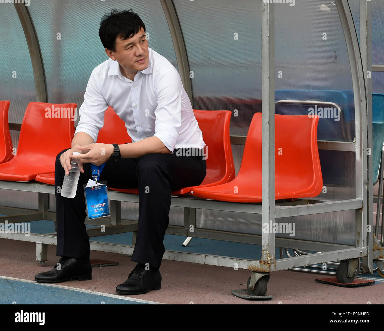 Ho Chi Minh, Vietnam. 17th May, 2014. China's head coach Hao Wei takes a rest before the Group B match against Myanmar at the 2014 Women's AFC Cup held at Thong Nhat Stadium in Ho Chi Minh city, Vietnam, May 17, 2014. China advanced to World Cup 2015 after beating Myanmar 3-0. © He Jingjia/Xinhua/Alamy Live News Stock Photo