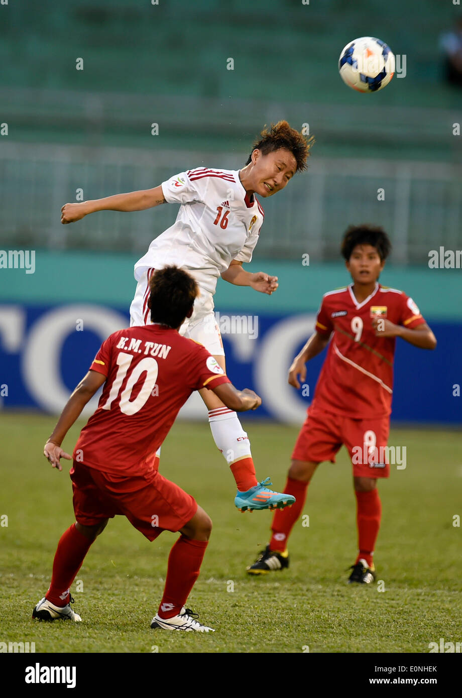 Ho Chi Minh, Vietnam. 17th May, 2014. Wang Chen (C) of China vies for the ball during the Group B match against Myanmar at the 2014 Women's AFC Cup held at Thong Nhat Stadium in Ho Chi Minh city, Vietnam, May 17, 2014. China advanced to World Cup 2015 after beating Myanmar 3-0. © He Jingjia/Xinhua/Alamy Live News Stock Photo