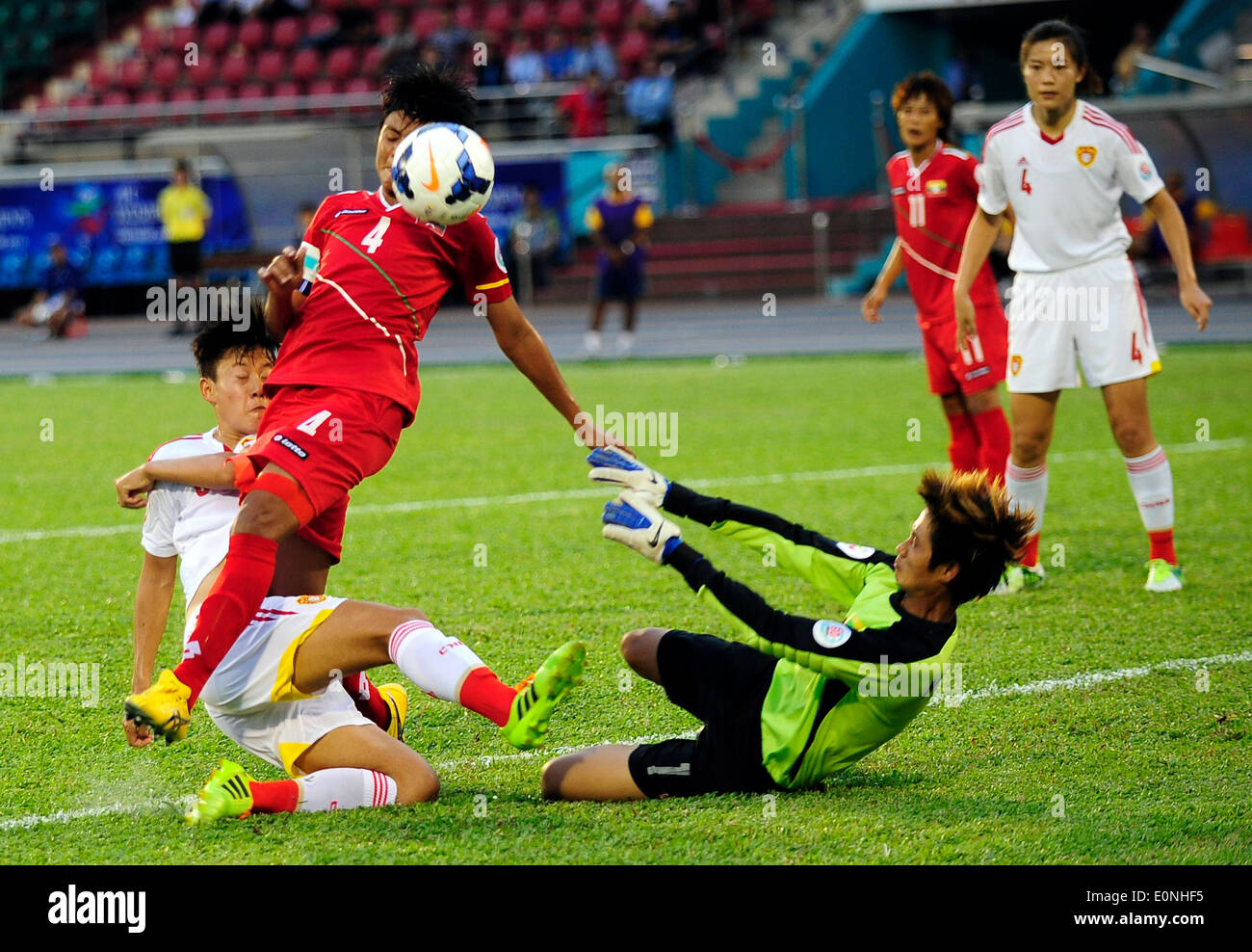 Ho Chi Minh, Vietnam. 17th May, 2014. Li Dongna (1st L) of China vies for the ball during the Group B match against Myanmar at the 2014 Women's AFC Cup held at Thong Nhat Stadium in Ho Chi Minh city, Vietnam, May 17, 2014. China advanced to World Cup 2015 after beating Myanmar 3-0. © He Jingjia/Xinhua/Alamy Live News Stock Photo