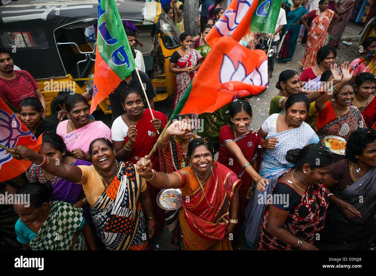 (140517) -- VISAKHAPATNAM, May 17, 2014 (Xinhua) -- Supporters of India's main opposition Bharatiya Janata Party (BJP) celebrate during a parade in Visakhapatnam of Andra Pradesh, India, May 17, 2014. BJP Friday created history by winning the general elections by a landslide, the most resounding victory by any party in the last 30 years, decimating the Nehru-Gandhi dynasty-led ruling Congress Party. (Xinhua/Zheng Huansong) Stock Photo