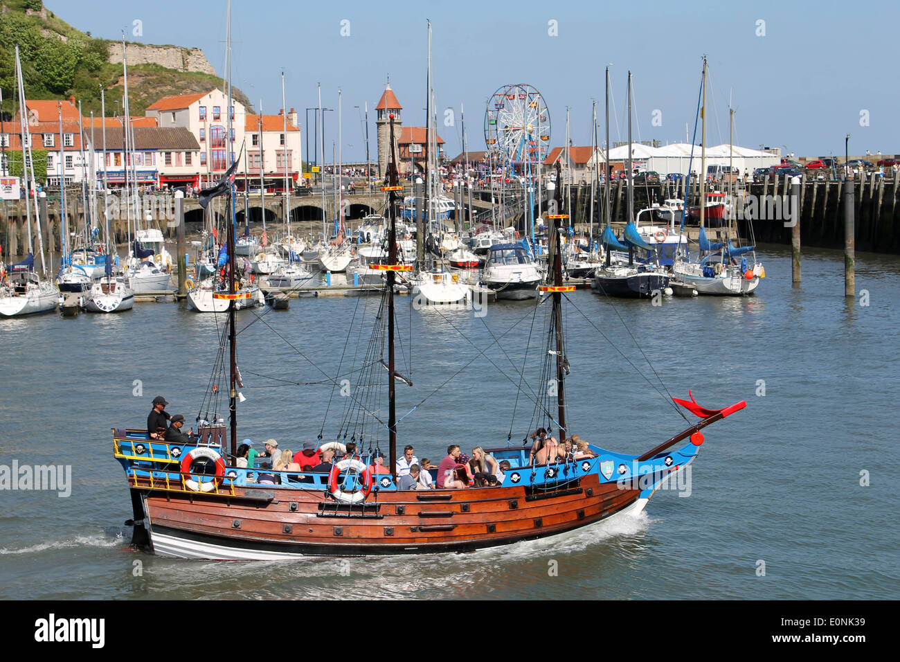 Scarborough, UK. 17th May 2014.  Scarborough South Bay harbor on the 17th of May 2014. A large number of tourists are visiting the town this weekend to enjoy the beautiful summer weather. People are enjoyinh a ride on the Hispaniola pirate ship. Credit:  Lifestyle pictures/Alamy Live News Stock Photo