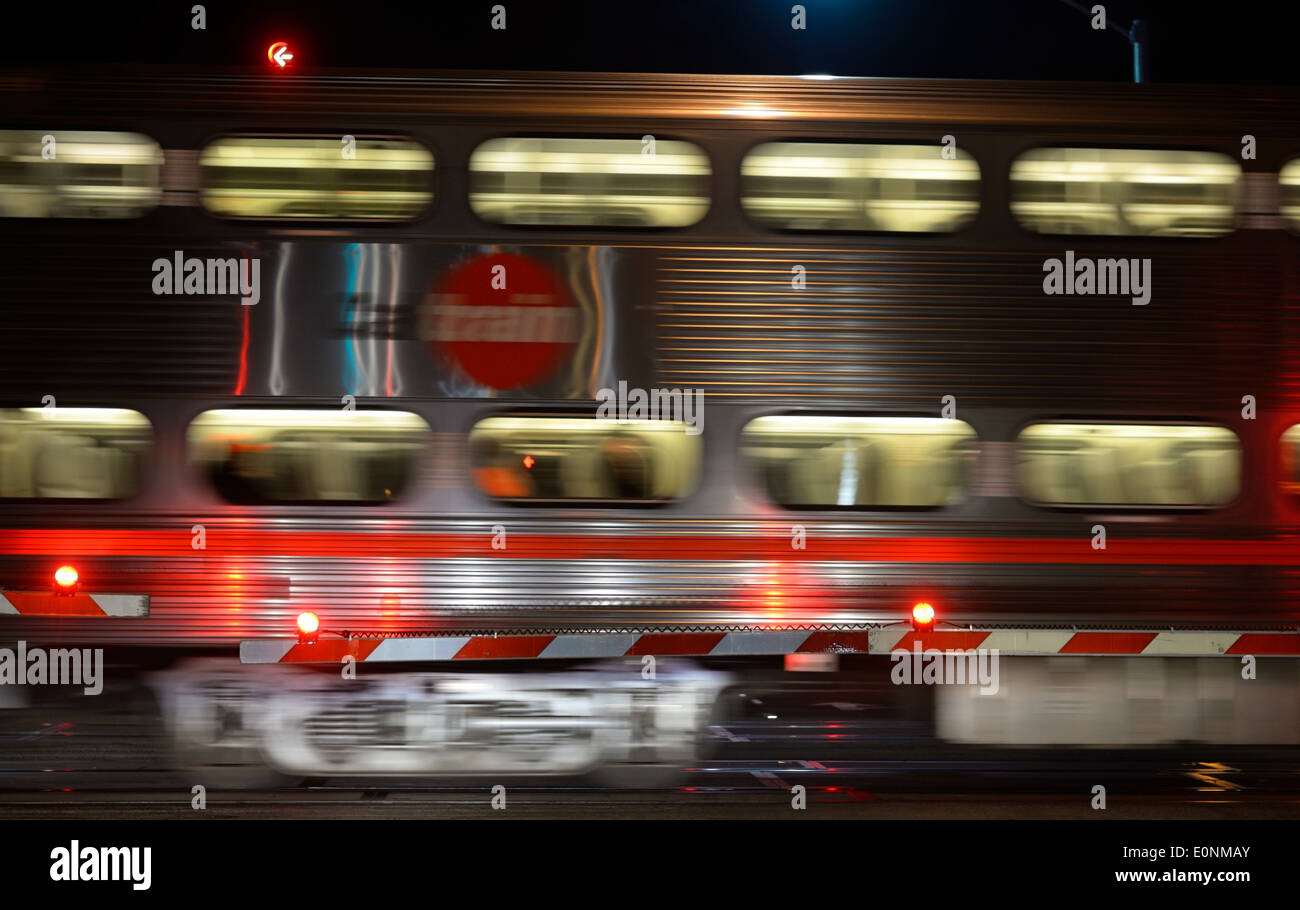 A Caltrain at a railroad crossing in Mountain View, CA Stock Photo