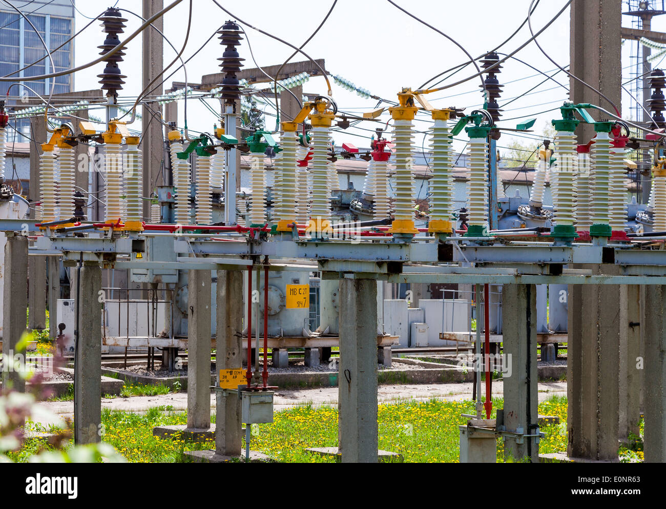 High voltage circuit breaker in a power substation in sunny day Stock Photo