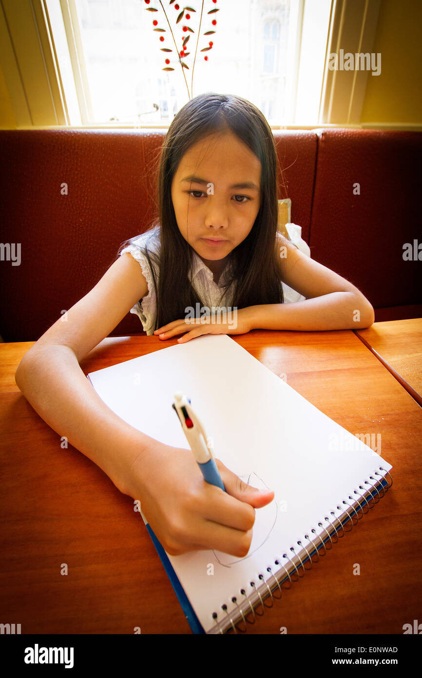 10 year old child drawing a picture hires stock photography and images