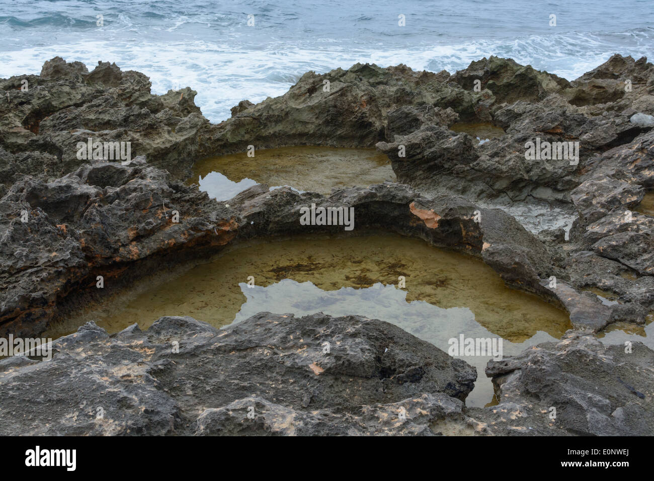 Ocean and natural pools of captured water with chemical salt water and