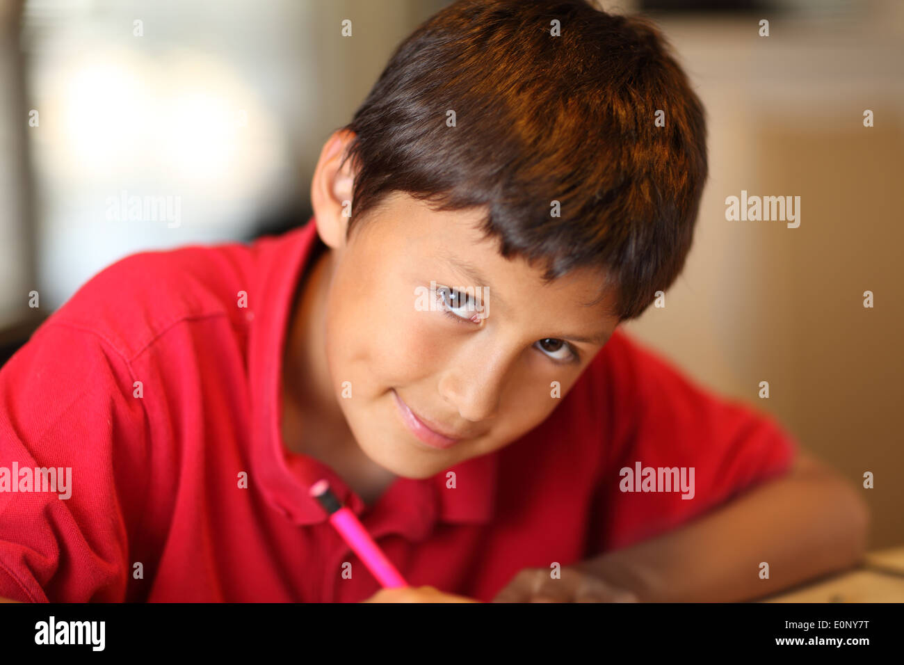 Young boy drawing for his homework - shallow depth of field Stock Photo