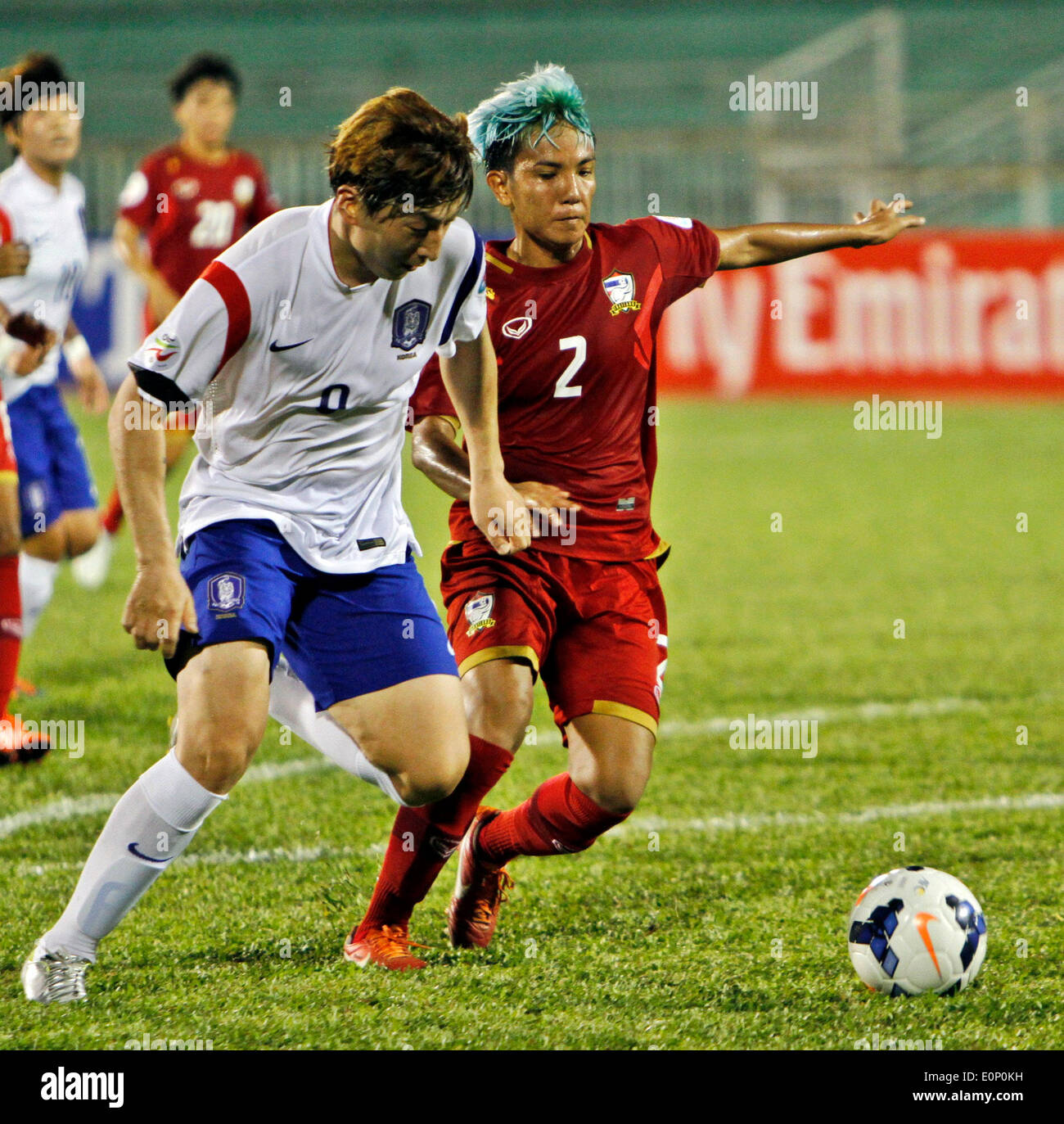 Ho Chi Minh, Vietnam. 17th May, 2014. Park Eun Sun (L) of South Korea vies for the ball during the Group B match against Thailand at the 2014 Women's AFC Cup held at Thong Nhat Stadium in Ho Chi Minh city, Vietnam, May 17, 2014. South Korea advance to World Cup after beating Thailand 4-0. Credit:  Nguyen Le Huyen/Xinhua/Alamy Live News Stock Photo