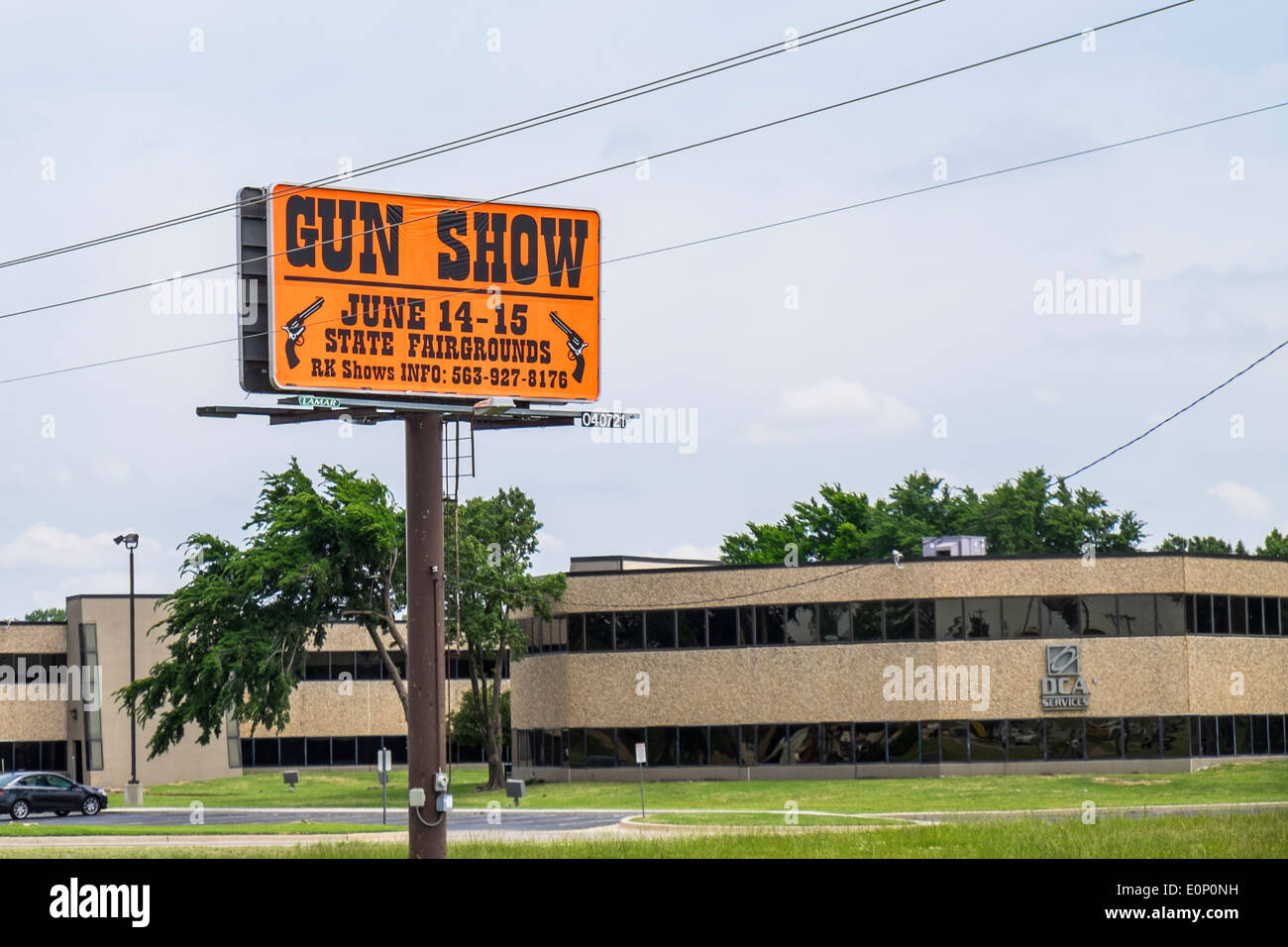 A streetside sign advertising a gun show in Oklahoma City, Oklahoma, USA. Stock Photo