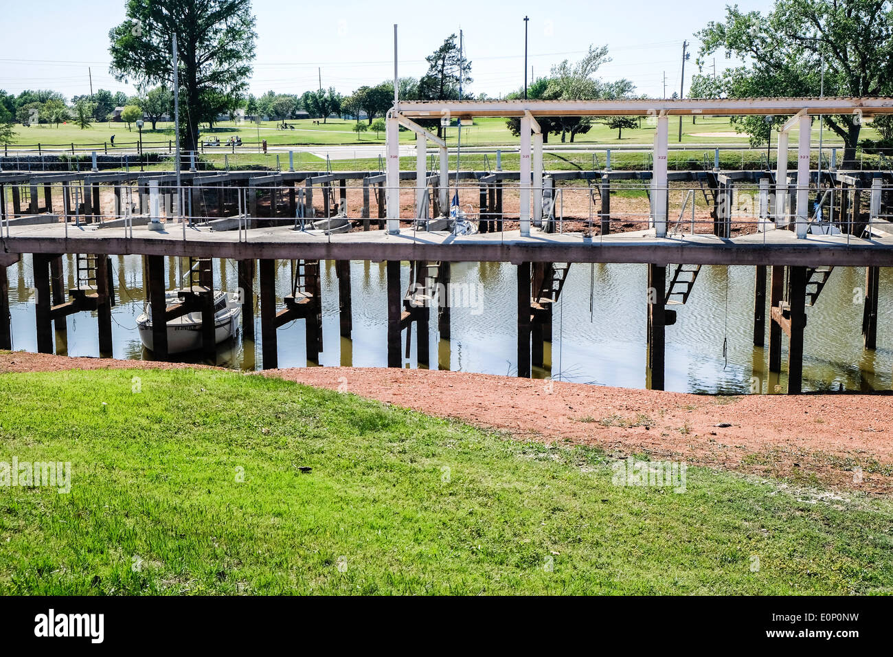 At Lake Hefner in Okllahoma City, Oklahoma, USA, a severe drought has lowered lake levels and left boats unable to dock. Stock Photo