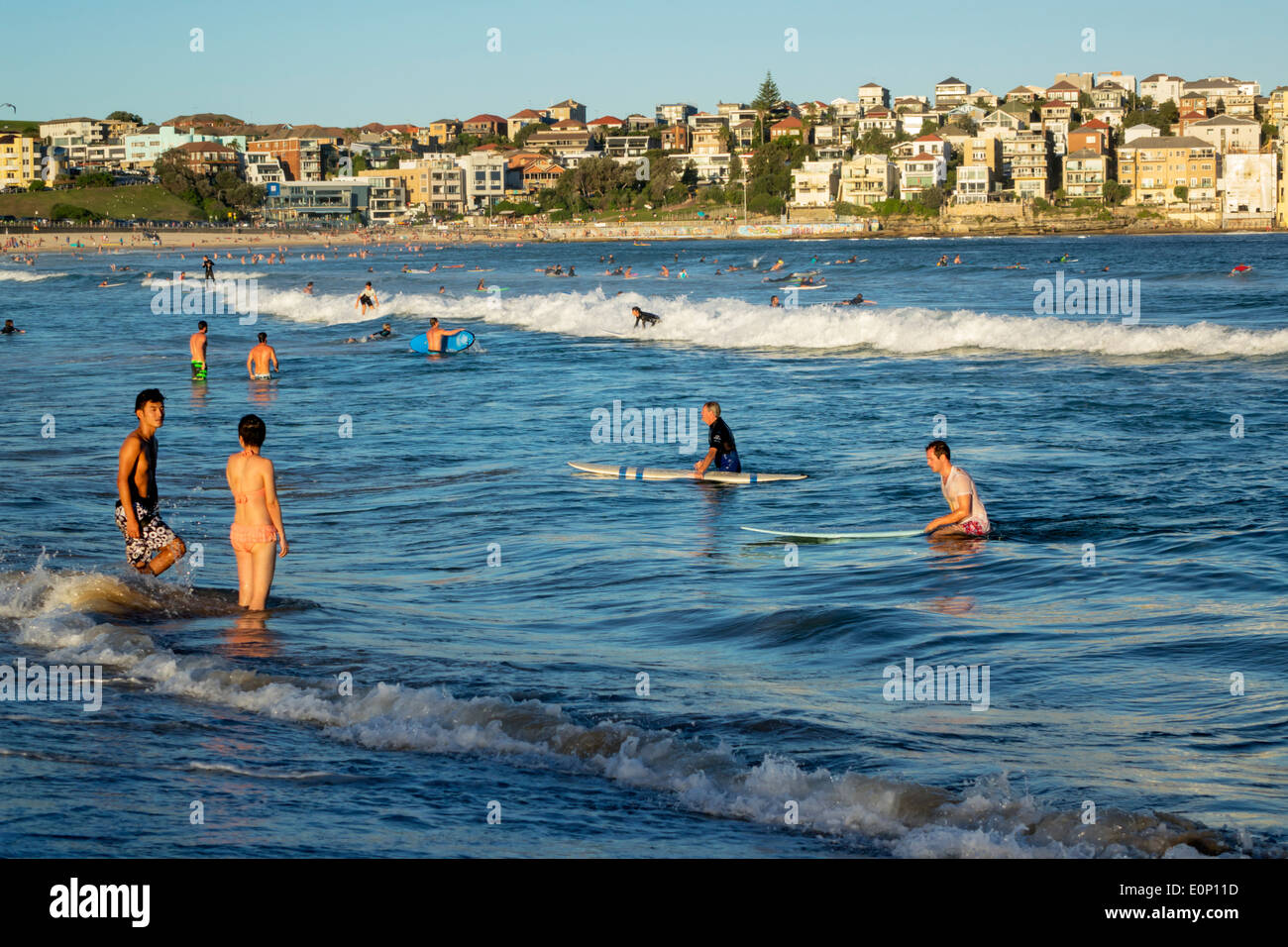 Sydney Australia,Bondi Beach,Pacific Ocean,surf,waves,sand,public,North Bondi,surfers,Asian man men male,woman female women,couple,AU140310207 Stock Photo
