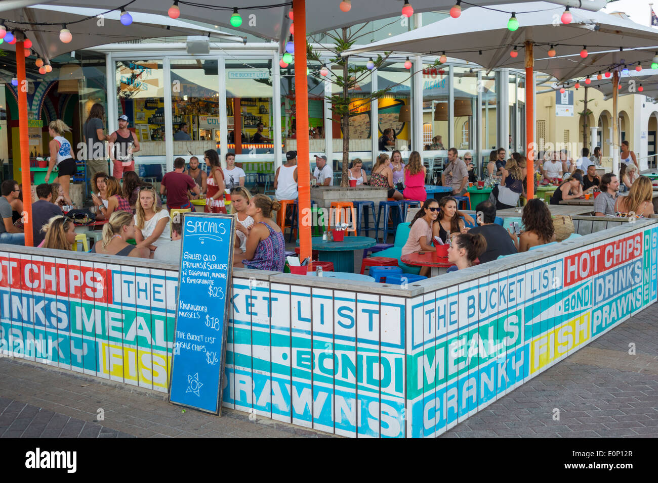 Sydney Australia,Bondi Beach,The Bucket List,restaurant restaurants food dining cafe cafes,al fresco sidewalk outside tables,man men male,woman female Stock Photo
