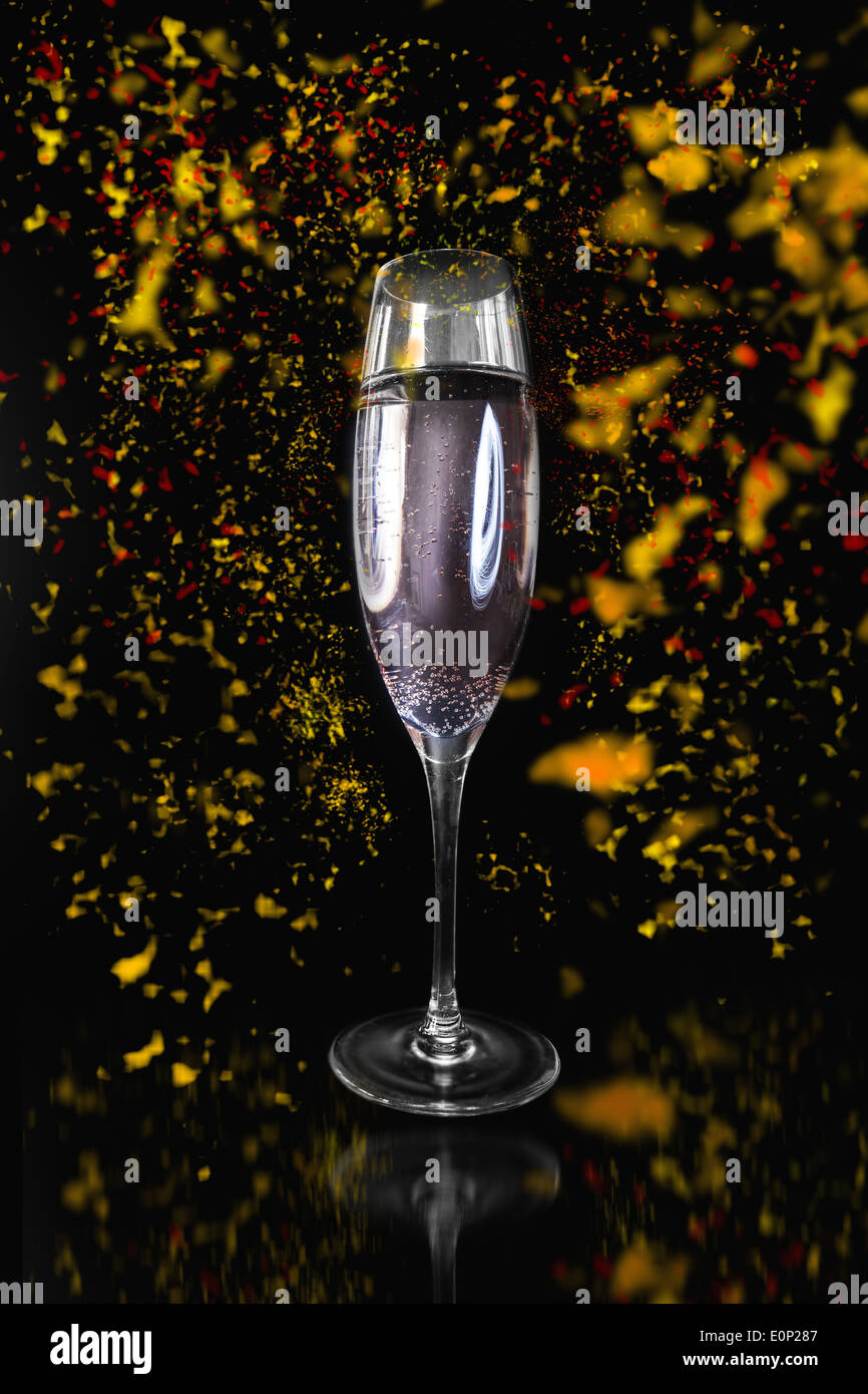 Flute of Champagne surrounded by confetti Stock Photo Alamy