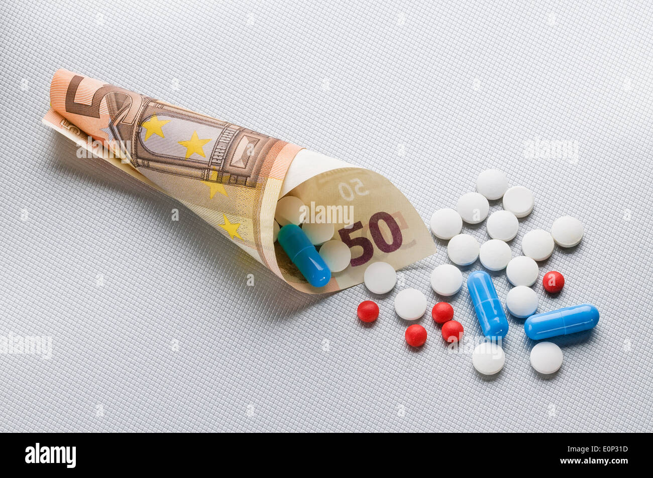 Pils and capsules with Euro money Stock Photo